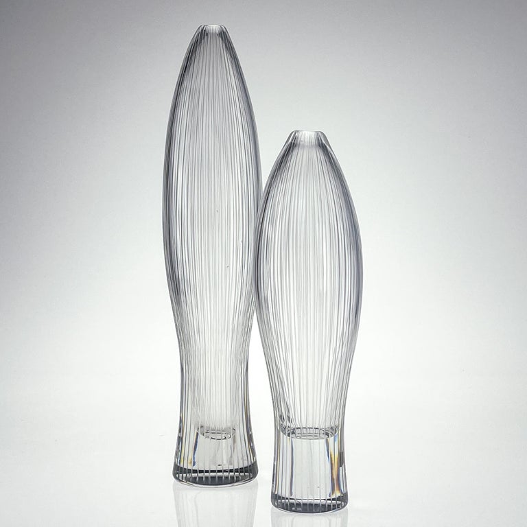 Tapio Wirkkala, a rare set of both sizes crystal art-object, model 3561, Iittala, Finland circa 1955

Two turned mold-blown crystal Art-object with vertical cut lines. These art-objects are model 3561 in the oeuvre of Tapio Wirkkala. It was