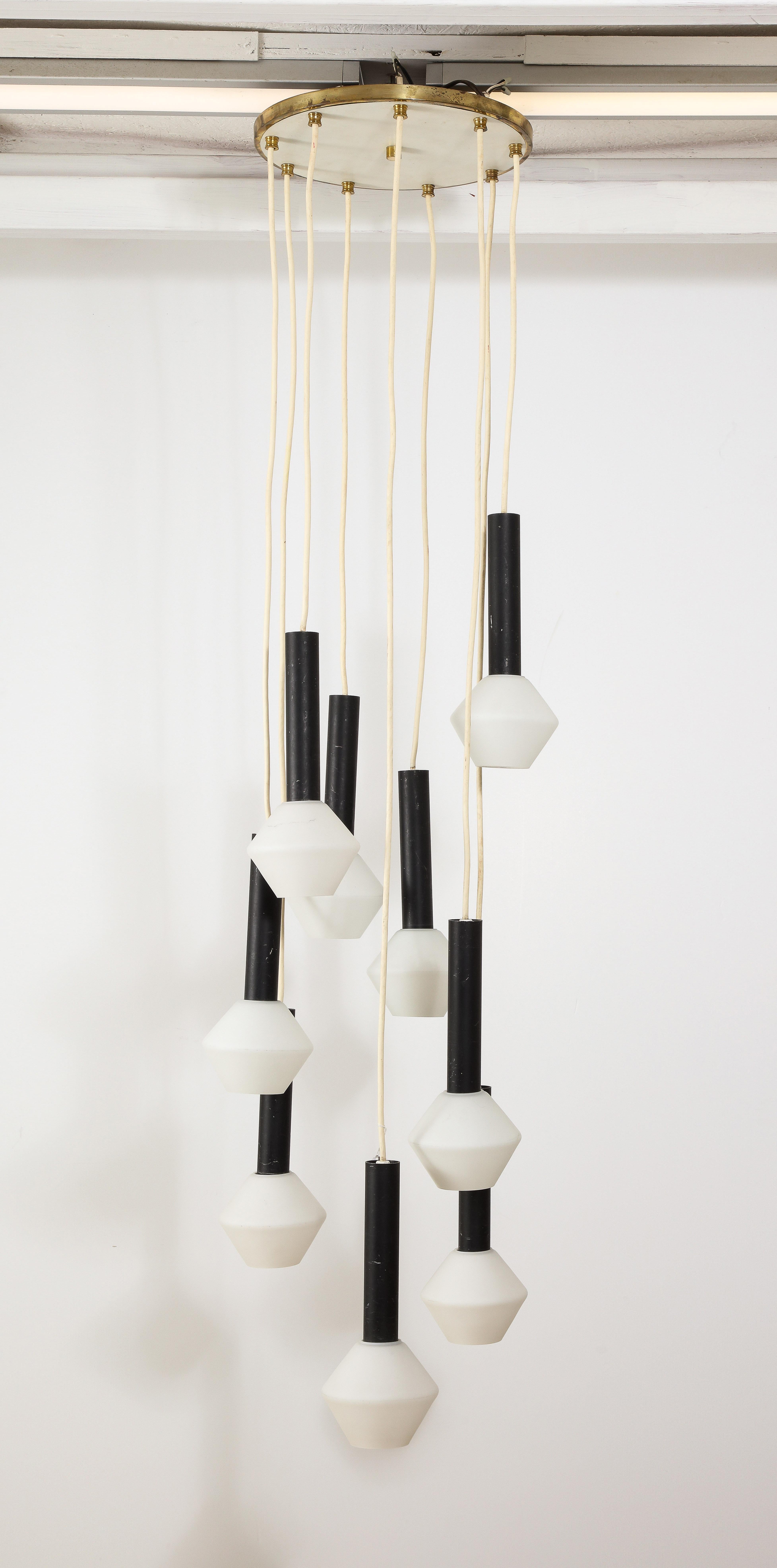 Large pendant fixture in enameled steel and brass, original “toupie” opaline shades. The drop can be adjusted by shortening or lengthening the wires.
