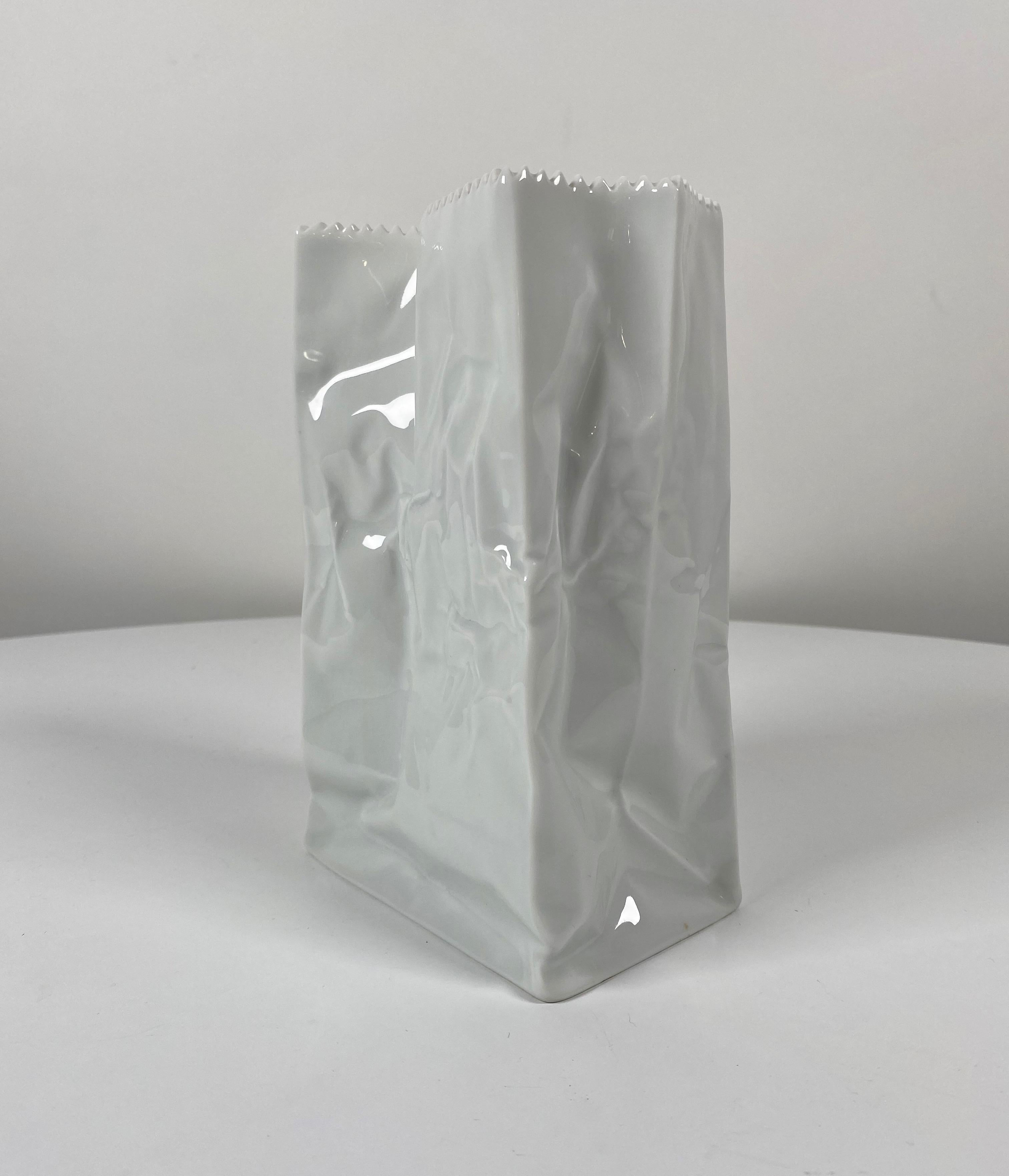 Iconic Finnish designer Tapio Wirkkala (1915-1985) for Rosenthal Studio-Line of Germany ceramic paper bag vase in a white glaze. Made to look like an old paper bag, this vase can be used to hold flowers or just as an object of beauty on a surface.