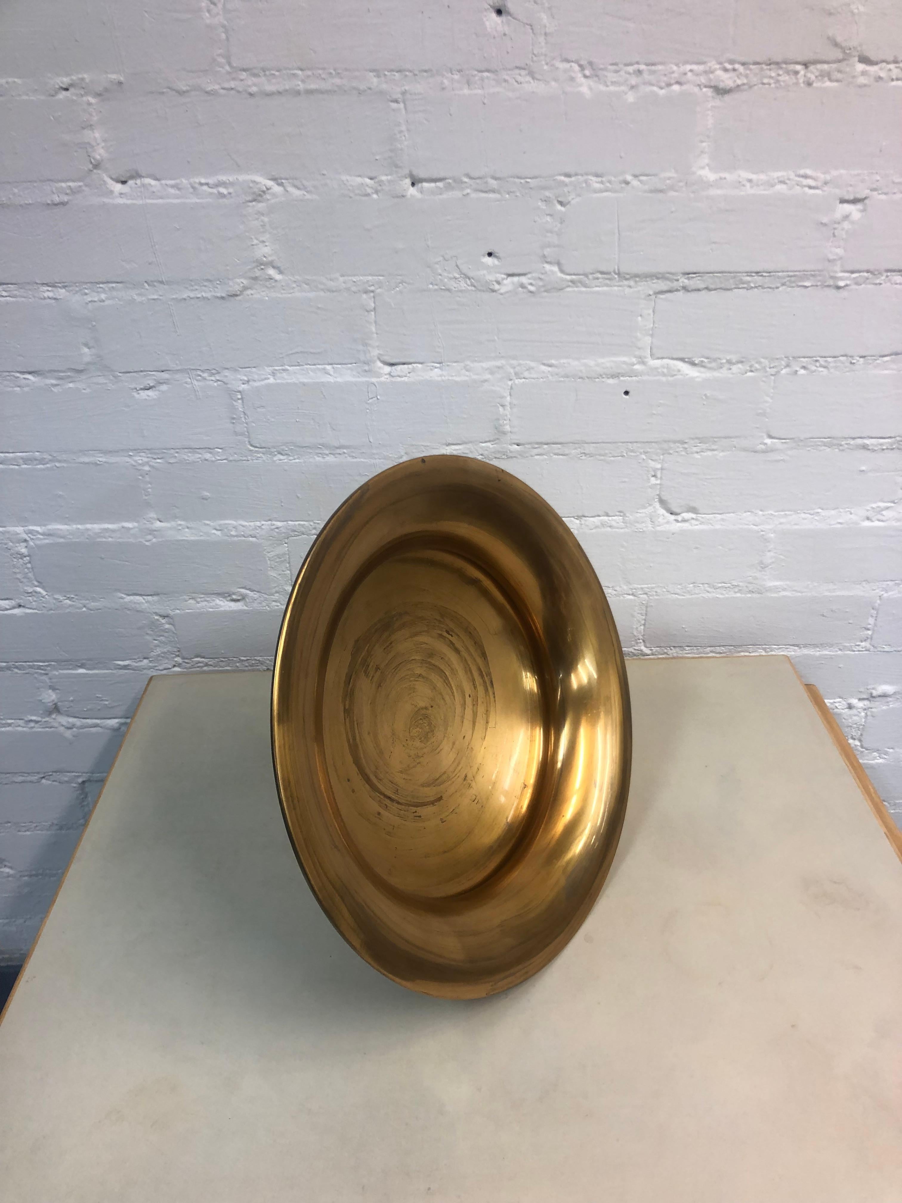 A special piece designed by the genious Tapio Wirkkala, only made upon requisition. This model 480 bowl is in full bronze, and is large enough to stand out on its own and make a statement. The elegance ascends from the simplicity of the design, and