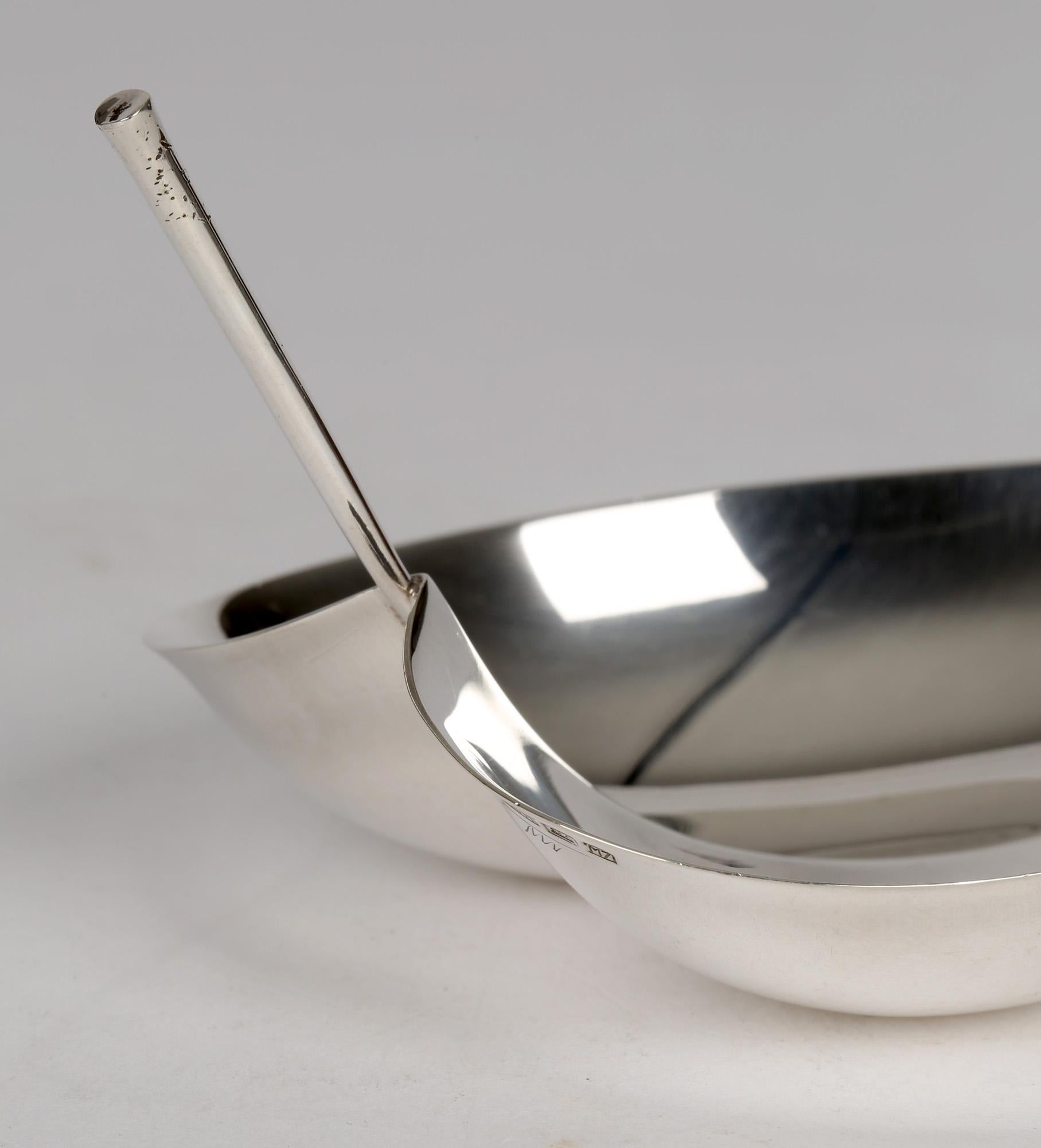 A stunning mid-century Finnish silver leaf shaped handled bon bon dish designed by Tapio Wirkkala (1915-1985) dated 1965. The dish is of a simple leaf shaped design formed like a heart with a raised rim and with a central ridge with a raised stalk
