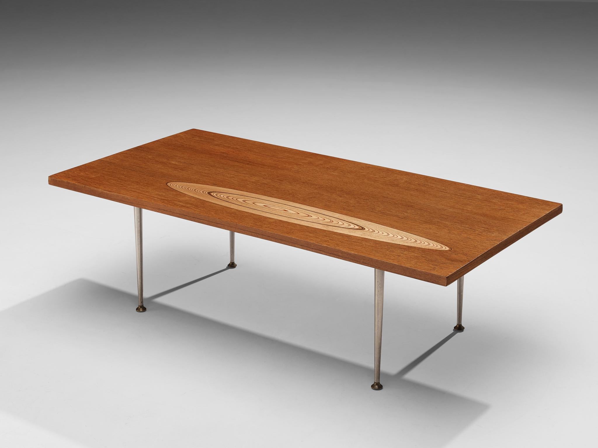 Tapio Wirkkala for Asko, cocktail table, birch, metal, Finland, 1960s.

This coffee table is one of Wirkkala's iconic furniture designs. Made with one oval shaped wood inlay that resembles the core of a tree with annual rings. The top is rectangular