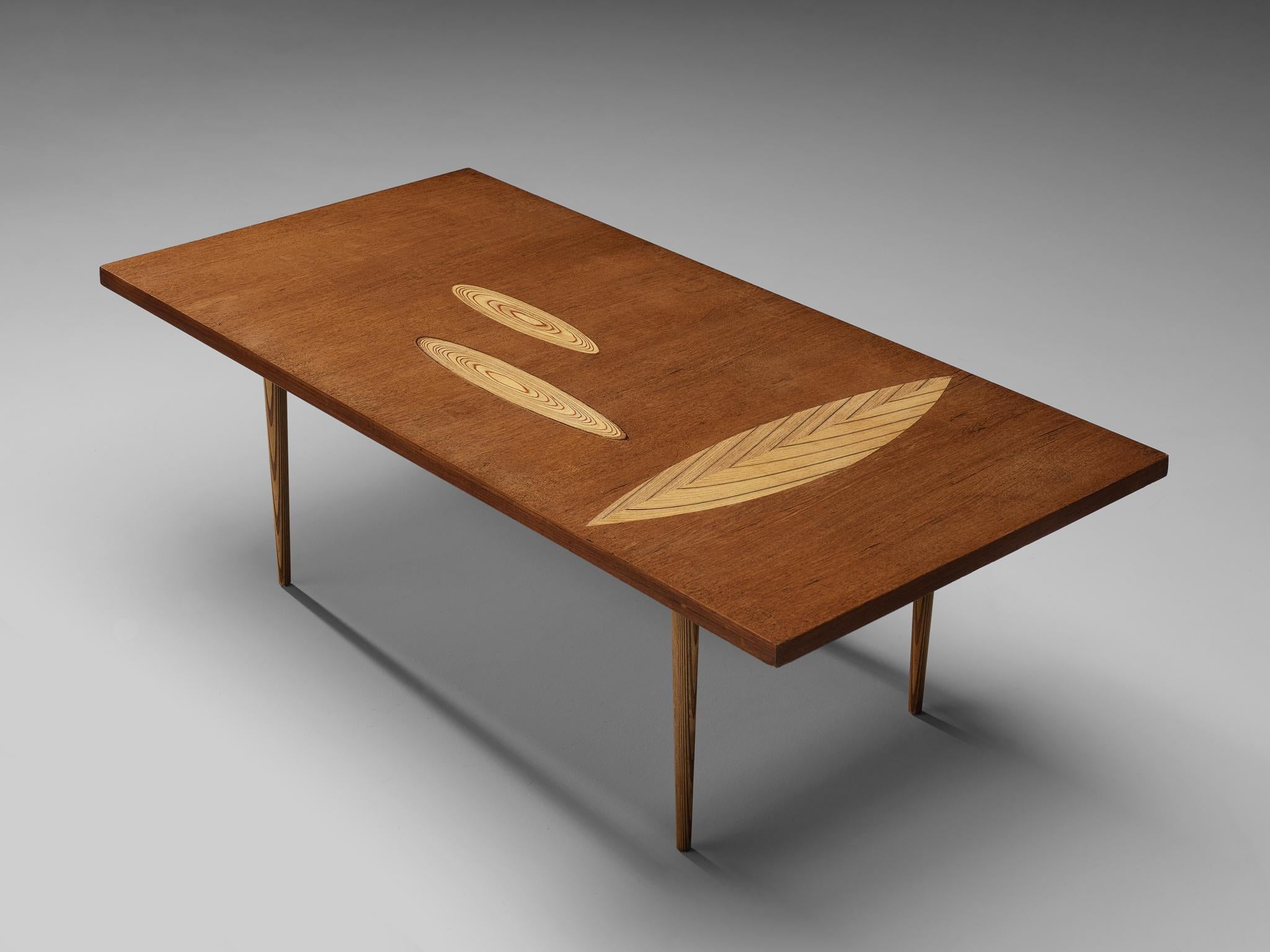 Tapio Wirkkala for Asko, cocktail table, teak, birch, Finland, 1960s.

Teak coffee table with wooden inlay ornaments designed by Tapio Wirkkala. The table is produced by Asko. This coffee table is one of Wirkkala's iconic furniture designs. Made