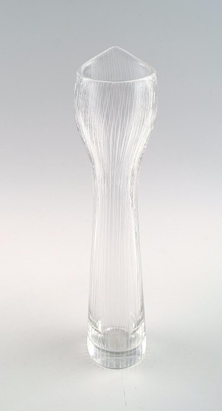 Tapio Wirkkala for Iittala.
Clear art glass vase with engraved decoration in the form of stripes.
Signed Tapio Wirkkala, Iittala, 1957. 
Finnish design.
Measures: 22 cm. x 4 cm.
In perfect condition.