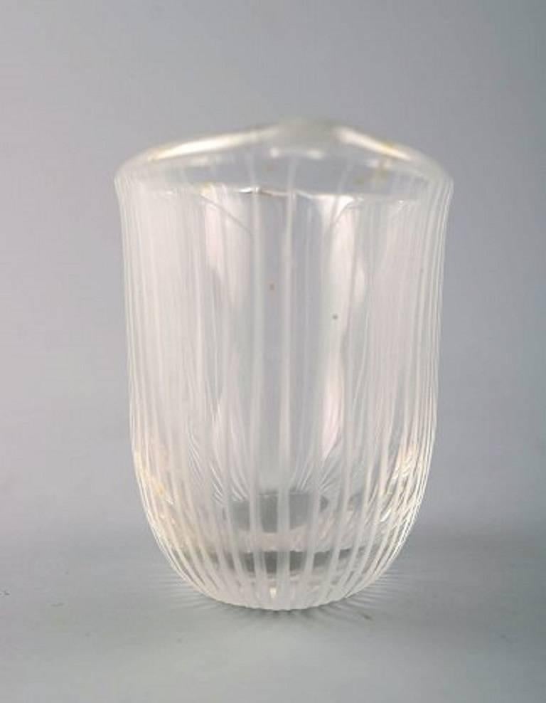 Tapio Wirkkala for Iittala, Finland, 1960s.
Clear glass vase with engraved decoration in the form of stripes.
Signed Tapio Wirkkala, Iittala.
Dimensions: 8.5 x 5.5 cm.
In perfect condition.