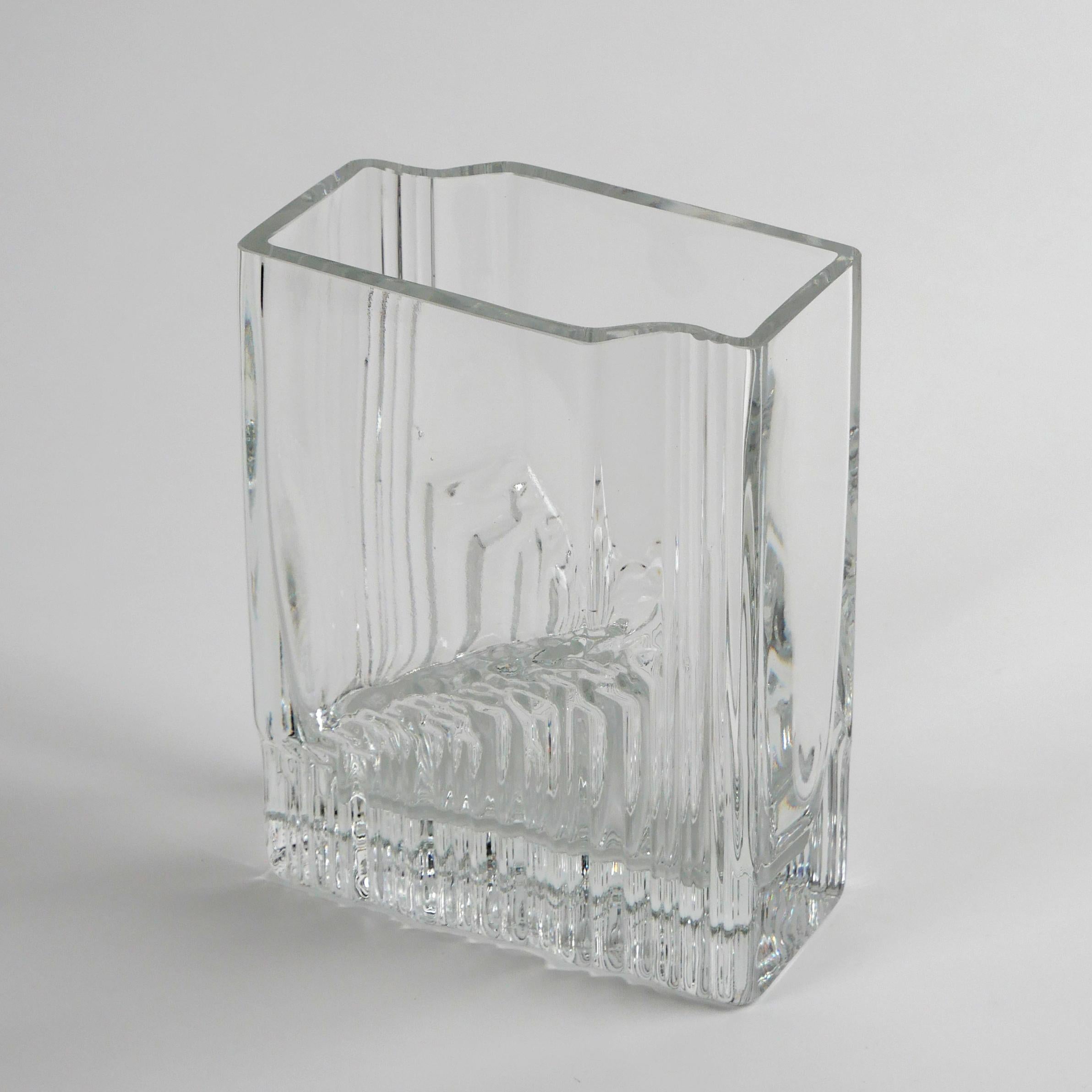 Tapio Wirkkala for Iittala, 1970
‘Sointu’ (Chord) vase

Clear glass
Excellent condition
Engraved signature to underside ‘TW’
This design was in production from 1970 to 1992.
Dimensions approx.: width 14cm, depth 9.5cm height 18cm; weight: