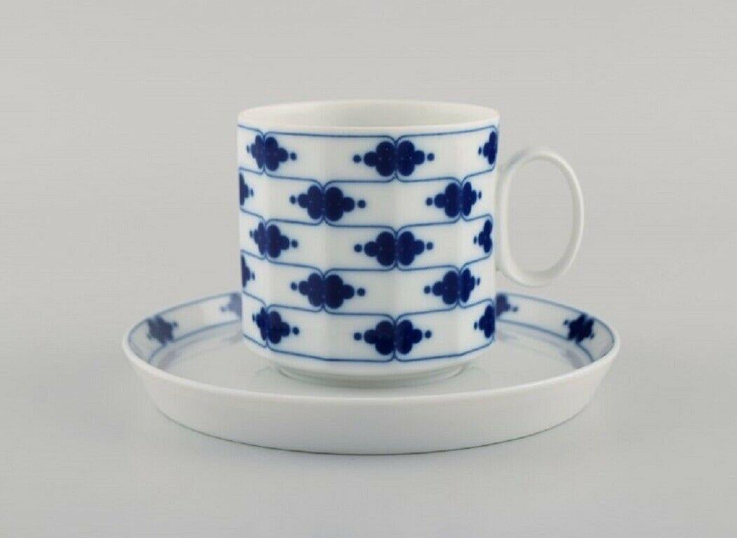 Tapio Wirkkala for Rosenthal. Corinth coffee service for twelve people in blue-painted porcelain. 
Modernist Finnish design. Dated 1979-80.
Consisting of twelve coffee cups with saucers, a sugar bowl and creamer.
The cup measures: 7 x 7