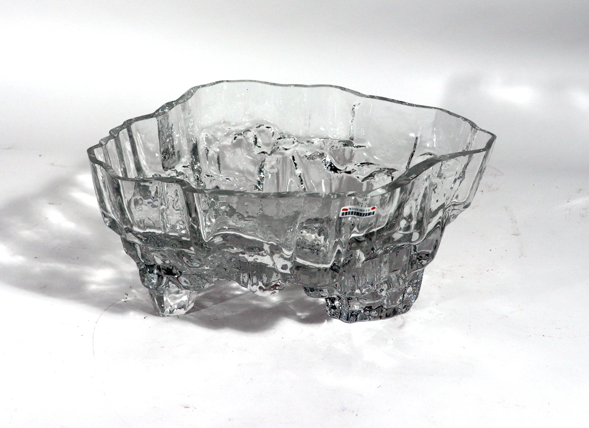 Tapio Wirkkala glass footed bowl,
Inari,
Model number 3543. 

Impressive cut and blown-molded footed bowl cast in clear glass by Finnish artist and designer, Tapio Wirkkala. Model number 3543. Signed by the Artist.

Measures: 6 5/8 inches high
