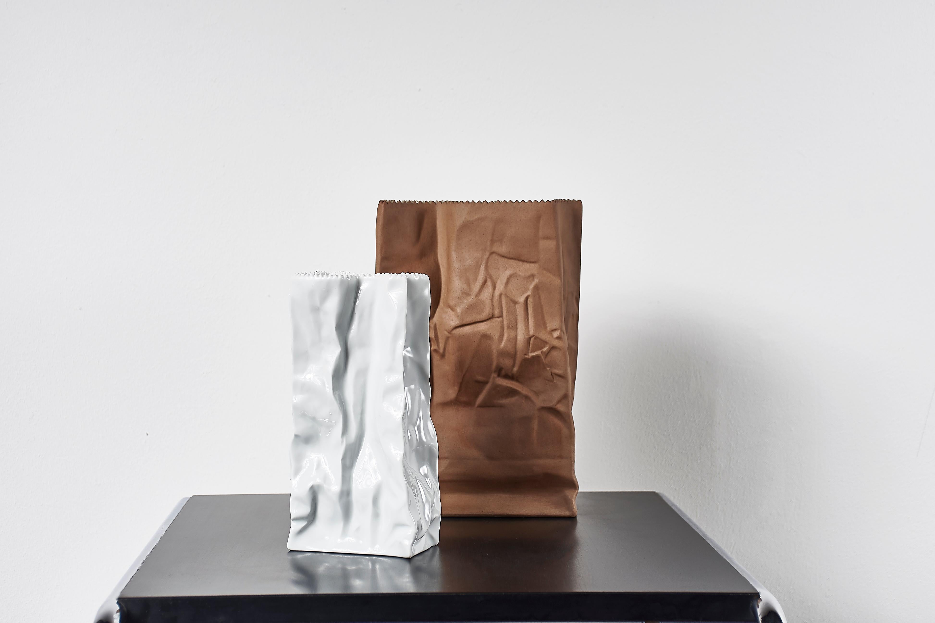 Paper or plastic or…Wirkkala’s fun and whimsical 1977 Pop Art take on tromp l’oeil, something that is not what it appears to be. Here, a used paper bag is actually a porcelain vase. Kraft paper with a serrated top edge. Perennially popular and