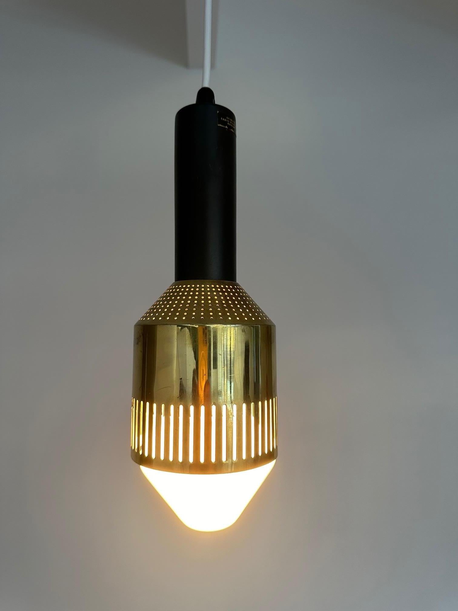 Rare ceiling lamp by Tapio Wirkkala with perforated brass shade and satin lacquered metal body,

Designed and manufactured between 1959 and 1961

The model is from a limited edition or a custom made model and carries label
Original Tapio Wirkkala