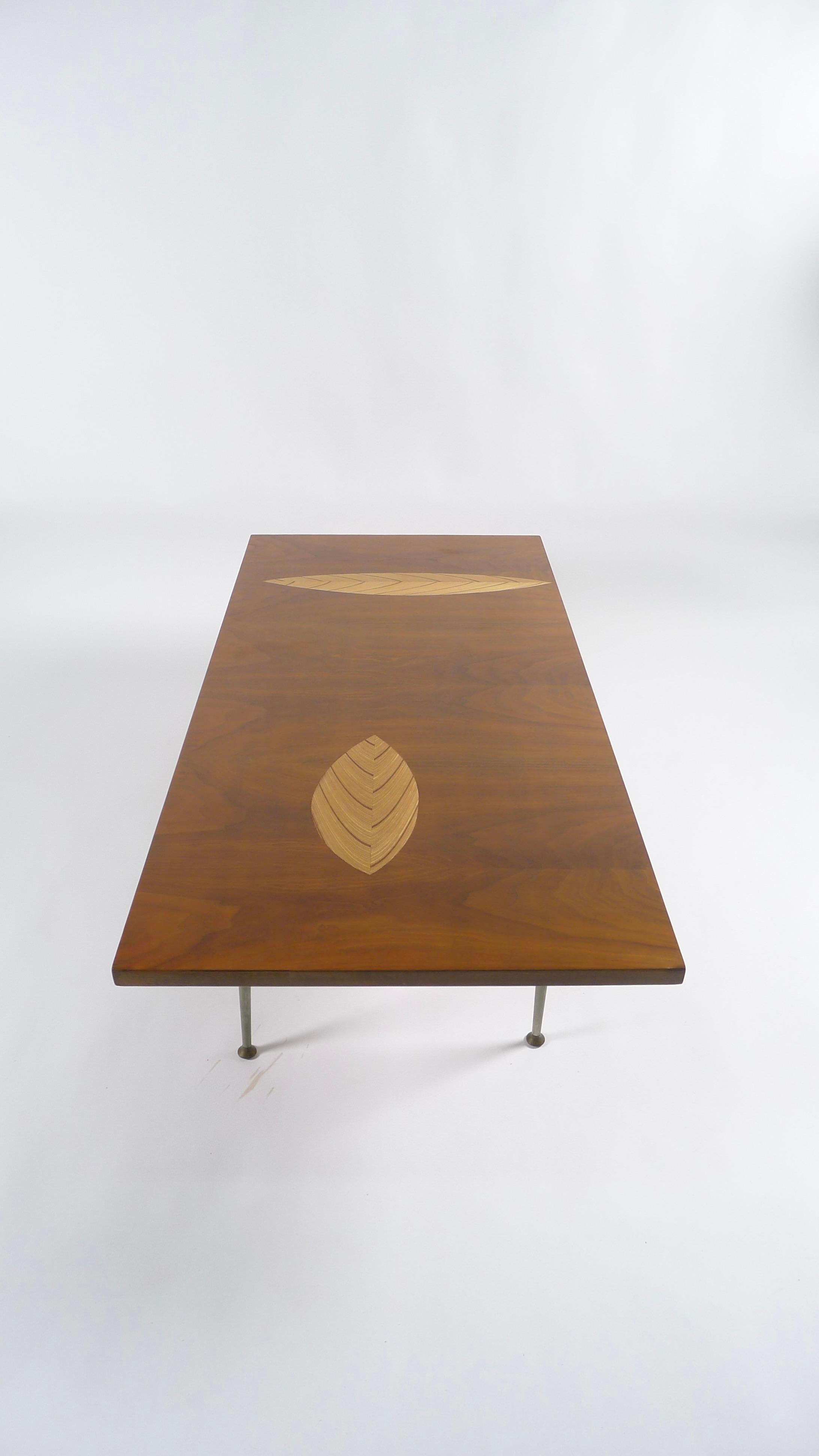 Rare leaf inlay coffee table, designed by Tapio Wirkkala and manufactured by Asko, Finland, 1950s, branded

Walnut with birch inlays, on adjustable nickel finished metal legs with brass pad feet

Measures: 120cm wide, 60cm deep, 40cm high.