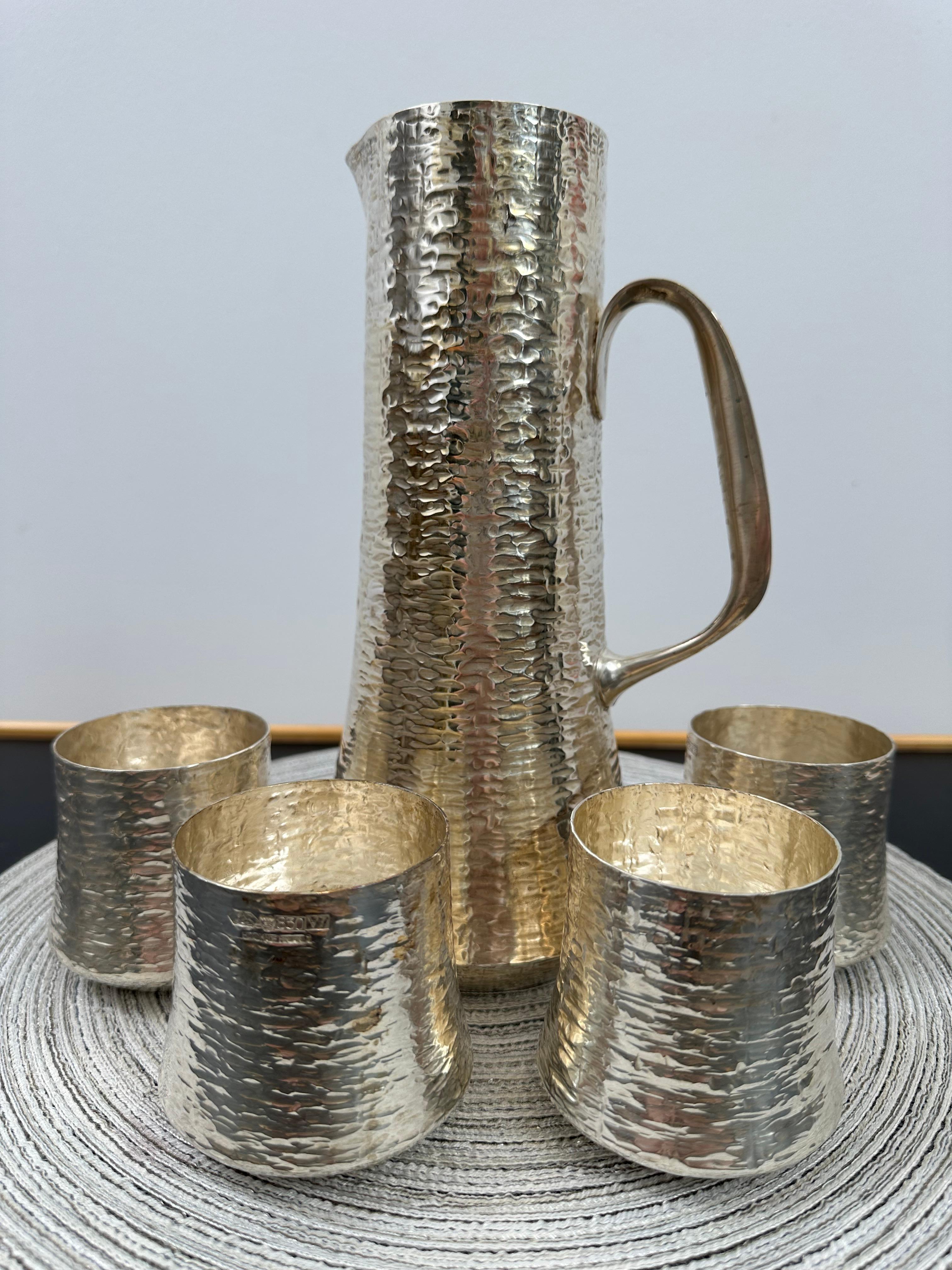Silver pitcher, designed by Tapio Wirkkala, manufactured by Kultakeskus Oy, 1970s. Hand hammered silver. Marked and signed. Good vintage condition, minor patina and wear consistent with age and use.