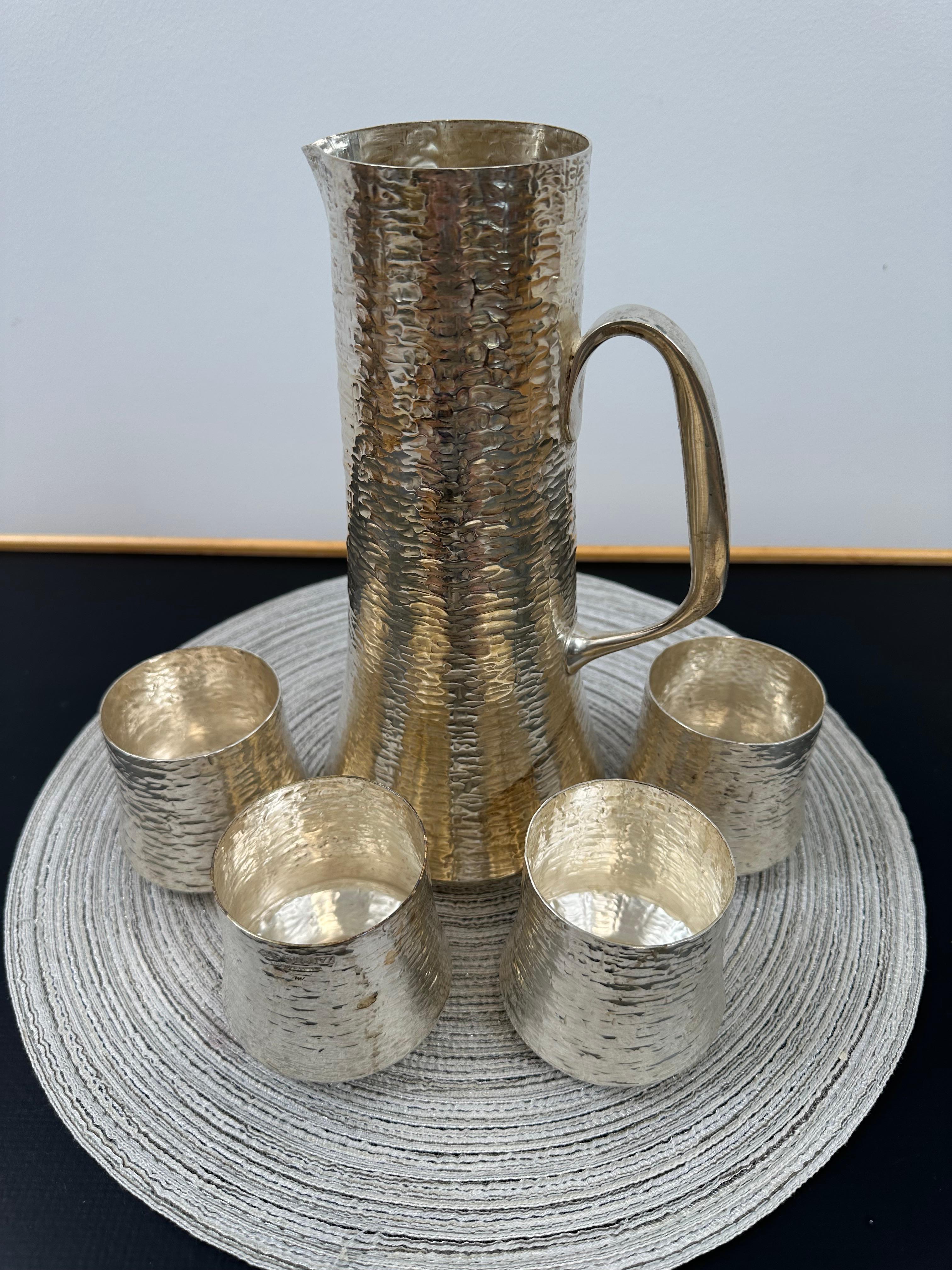 Scandinavian Modern Tapio Wirkkala Set of Sterling Silver Hand Hammered Cups and a Pitcher For Sale