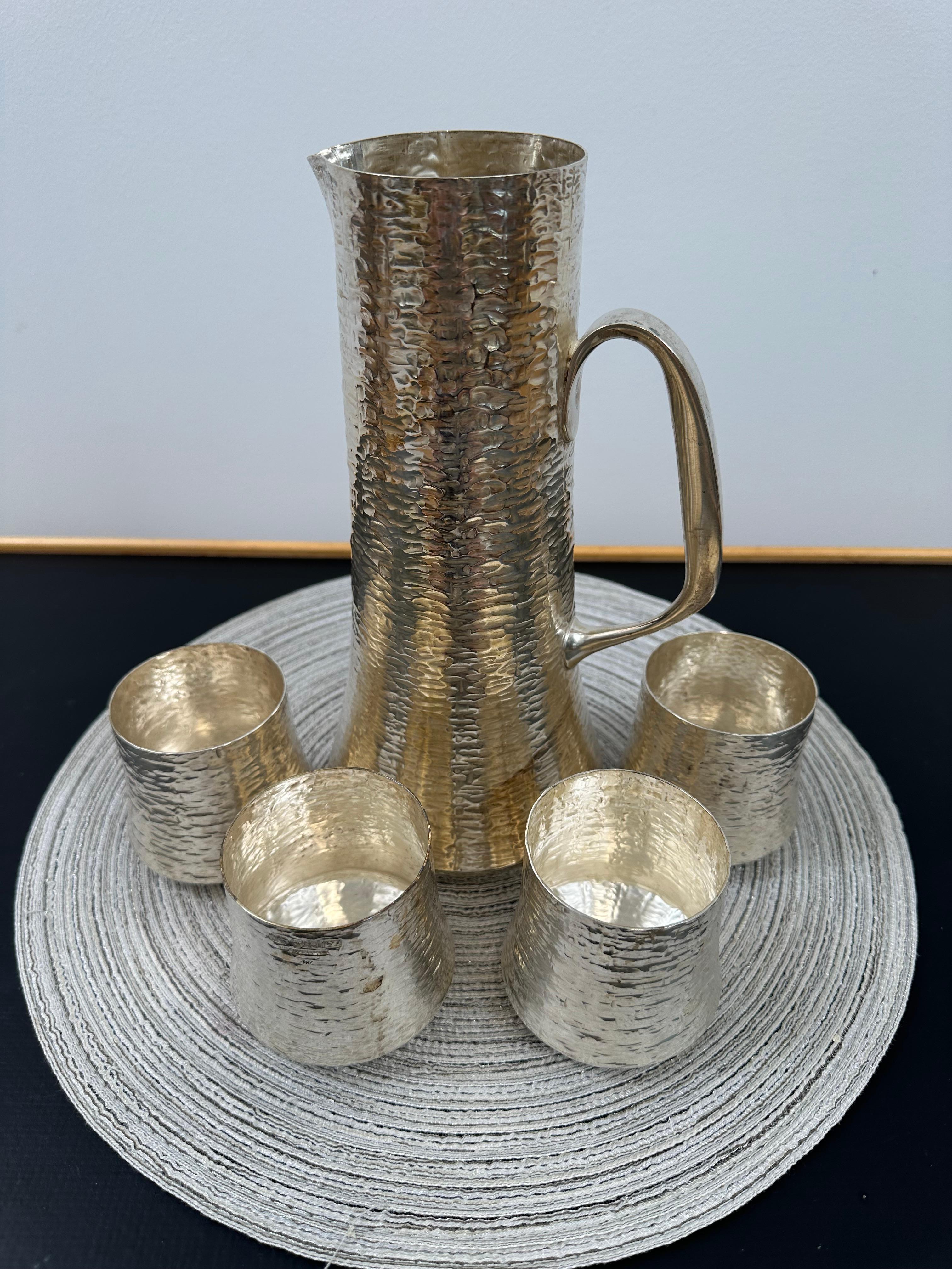 Finnish Tapio Wirkkala Set of Sterling Silver Hand Hammered Cups and a Pitcher For Sale