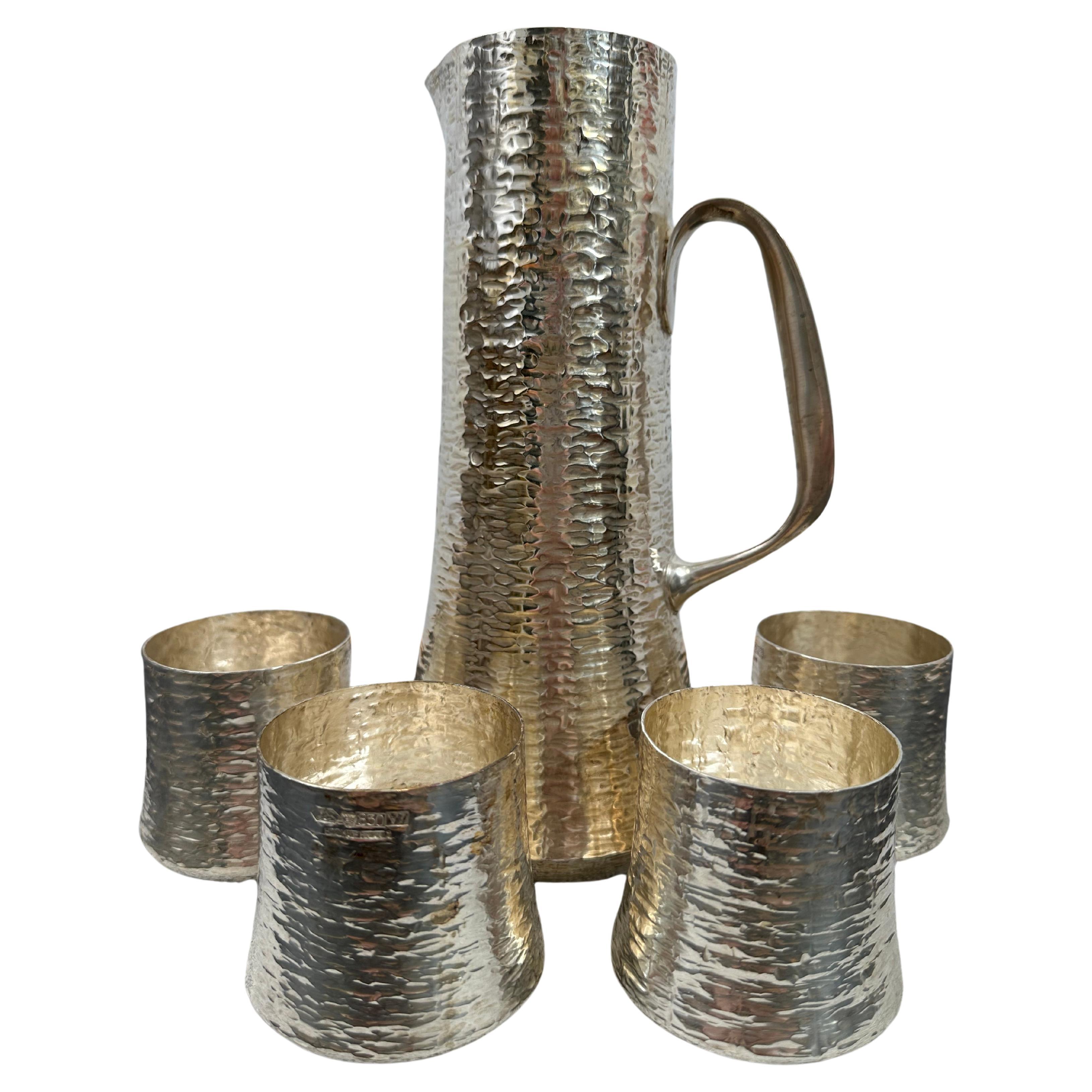 Tapio Wirkkala Set of Sterling Silver Hand Hammered Cups and a Pitcher For Sale