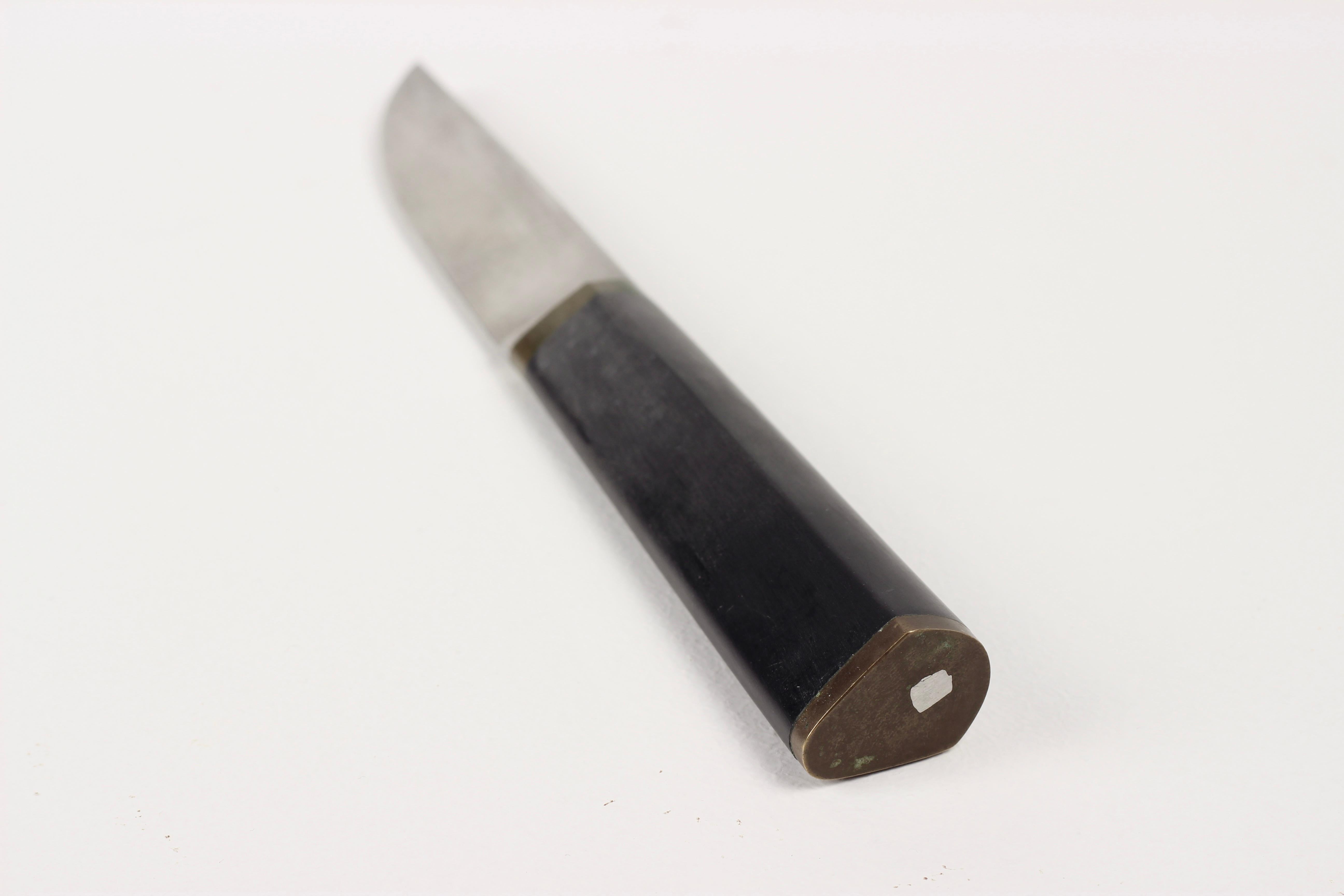 Tapio Wirkkala Puukko Knife by Hackman  Finnish Design

This vintage Puukko knife, designed by renowned Finnish designer Tapio Wirkkala and produced by Hackman in 1961, is a quintessential piece of Scandinavian craftsmanship. The Puukko is a