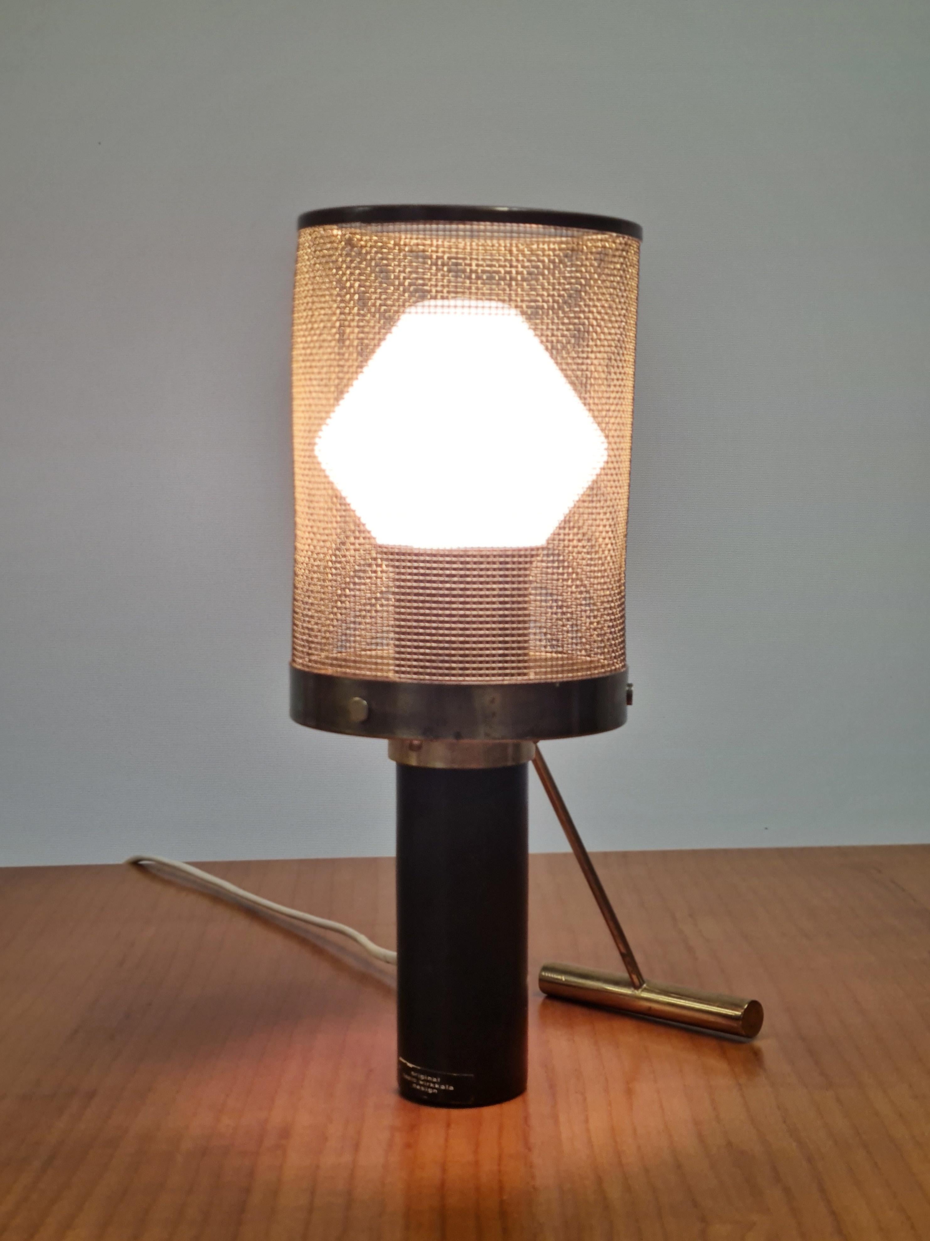 This bijou and elegant table lamp model K11-81  designed by Tapio Wirkkala, is hard to come by, which makes this piece a great addition to any collection. It objectifies Wirkkala's superb understanding of geometry and his talent in conveying it with