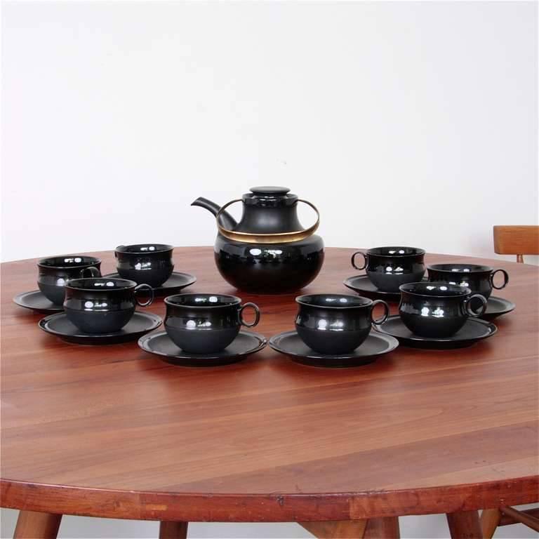 Set of 8 cups with saucers plus pitcher with brass handle. No chips!


