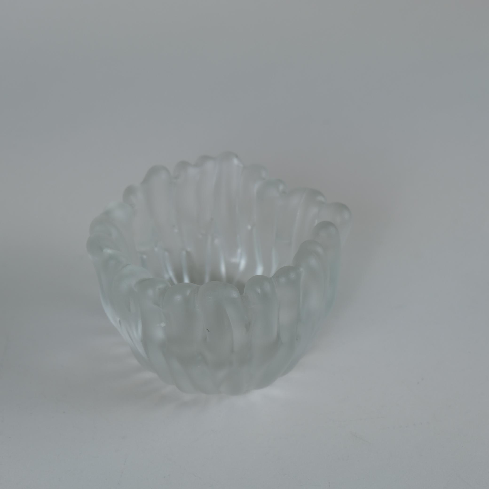 A beautiful art glass vase model 3516, designed by Tapio Wirkkala and manufactured by Iittala in Finland in the 1950s. In the manufacturing process the glass is blown in to a special mould and acidified to complete the beautiful velvet impression.