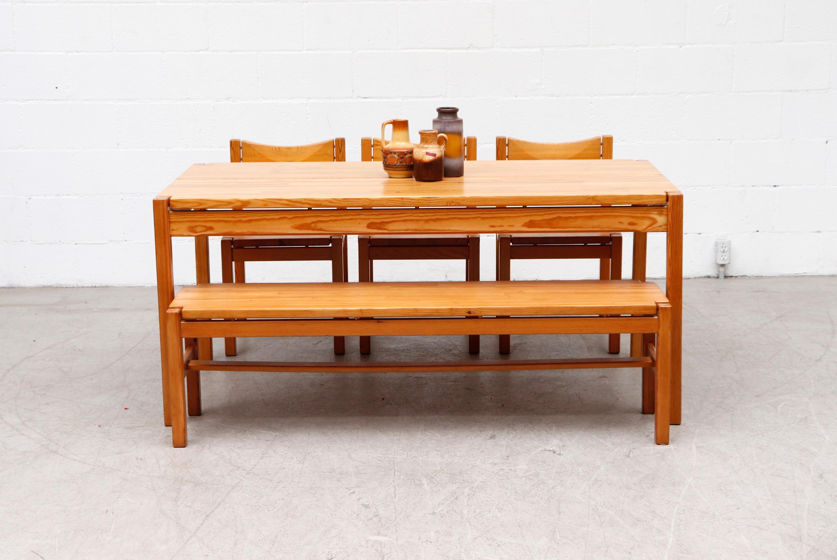 Midcentury Ilmari Tapiovaara dining set with pine table, 3 chairs and a matching bench. In Original condition with Visible Wear Consistent with its age and use. Bench measures 58.25 x 14.75 x 16.75 and the chairs measure 17.25 x 17 x 17/29.5. Set