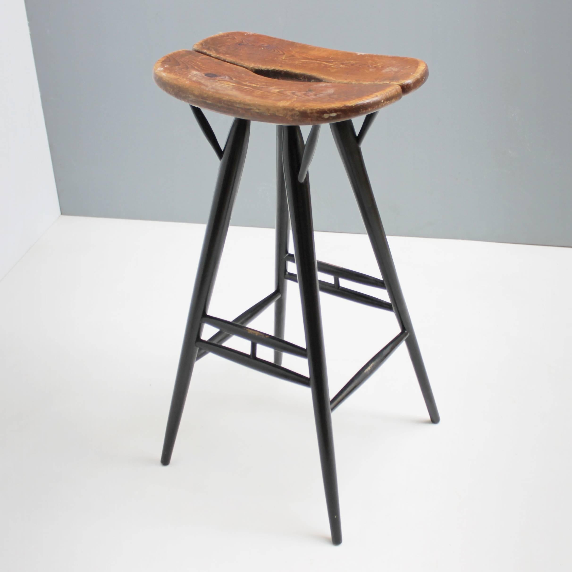 Rare bar stool Pirkka by Ilmari Tapiovaara for Laukaan Puu, Finland. Early edition, marked. Seat of solid pine, base of lacquered solid birch. Good vintage condition not restored. Dimensions: height 31.1 in. (79 cm), depth 11.2 in. (28.5 cm), width