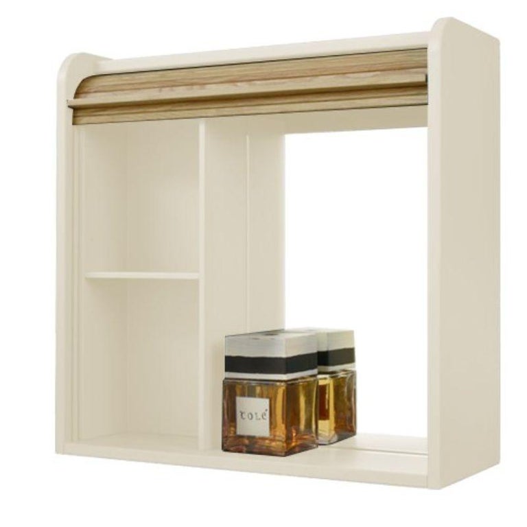 Tapparelle Hanging Unit, Lacquered in Sand White by Colé Italia with Emmanuel Gallina
Dimensions: H.60, D.60, W.22 cm
Materials: Container with “tapparella” sliding shutter in solid oak. Matt lacquered structure
1 veneered oak shelf inside.
