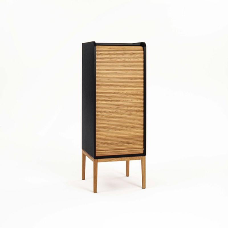 Tapparelle medium cabinet, black by Colé Italia with Emmanuel Gallina
Dimensions: H.115 D.42 W.42 cm
Materials: Container with legs and “tapparella” sliding shutter in solid oak.
Matt lacquered structure; inside 2 oak veneered shelf

Also