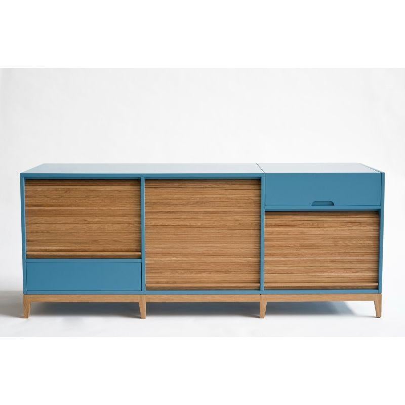 Tapparelle sideboard, Azure by Colé Italia with Emmanuel Gallina
Dimensions: H.75 D.50 W.160 cm
Materials: Container with legs and “tapparella” sliding shutter in solid oak. Matt lacquered structure;
1 push-pull drawer and a a folding door with