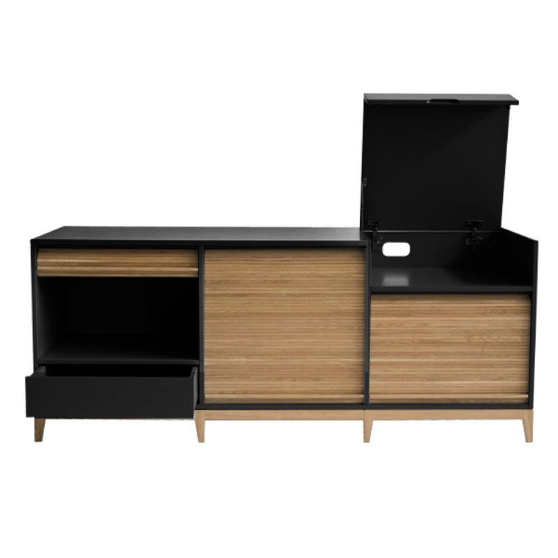 Tapparelle sideboard, Black by Colé Italia with Emmanuel Gallina
Dimensions: H.75 D.50 W.160 cm
Materials: Container with legs and “tapparella” sliding shutter in solid oak. Matt lacquered structure;
1 push-pull drawer and a a folding door with