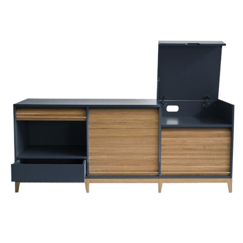Tapparelle sideboard, blue / grey by Colé Italia with Emmanuel Gallina.
Dimensions: H.75 D.50 W.160 cm.
Materials: Container with legs and “tapparella” sliding shutter in solid oak. Matt lacquered structure;
1 Push-pull drawer and a a folding