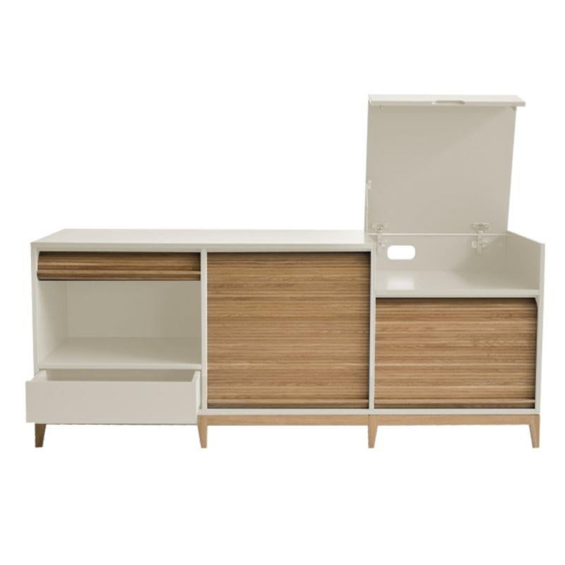 Tapparelle sideboard, sand white by Colé Italia with Emmanuel Gallina
Dimensions: H.75 D.50 W.160 cm
Materials: Container with legs and “tapparella” sliding shutter in solid oak. Matt lacquered structure;
1 push-pull drawer and a a folding door with