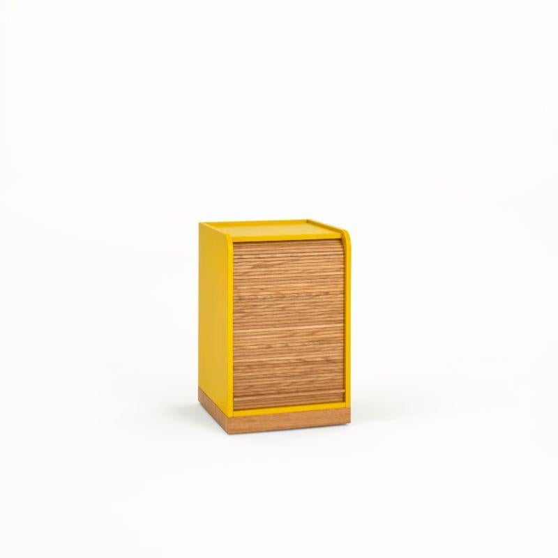 Tapparelle wheels cabinet, mustard yellow by Colé Italia with Emmanuel Gallina
Dimensions: H.55 D.40 W.40 cm
Materials: Container on wheels with plinth and “tapparella” sliding shutter in solid oak.
Matt lacquered structure; handle in leather;