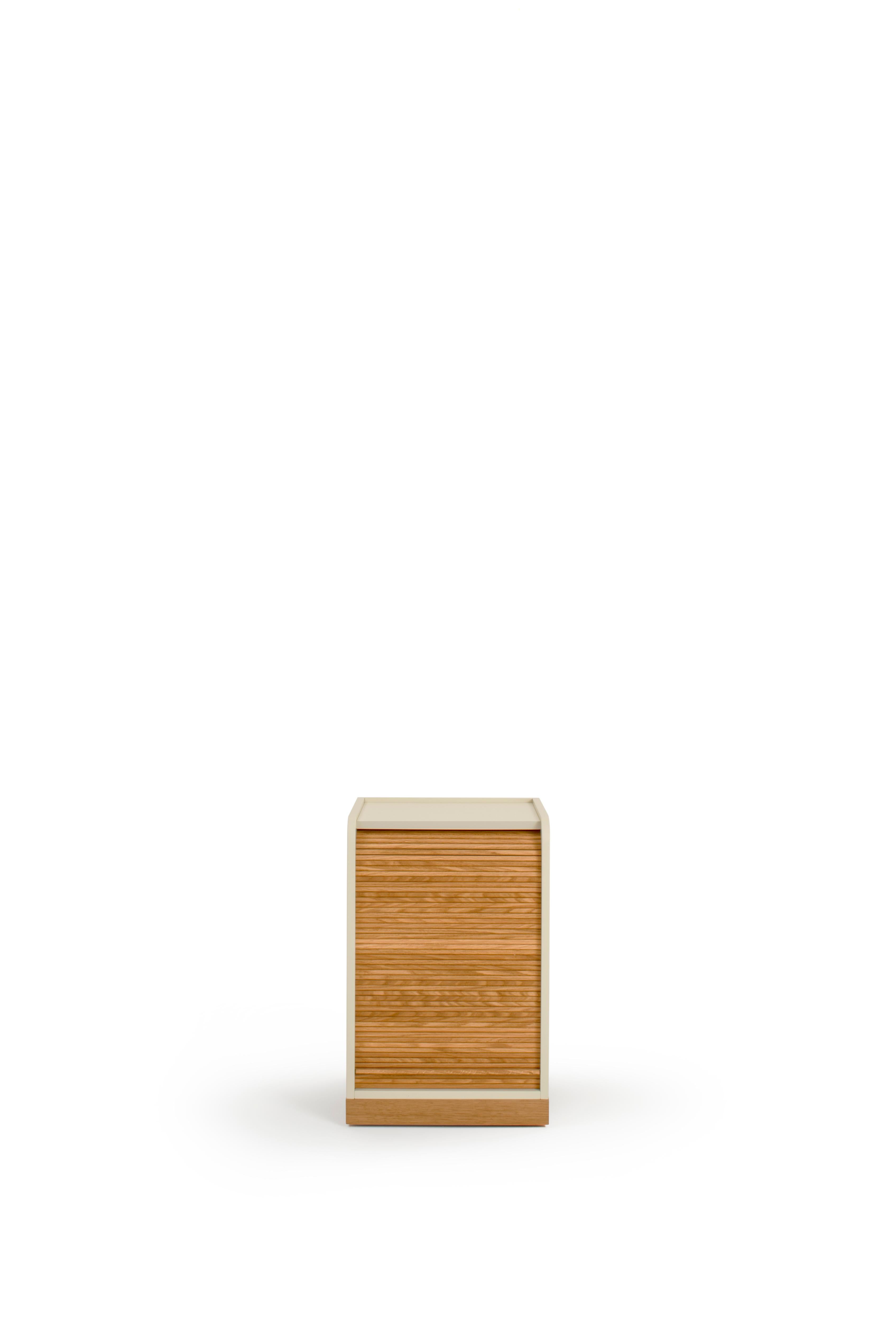 Tapparelle wheels cabinet, sand white by Colé Italia with Emmanuel Gallina
Dimensions: H.55 D.40 W.40 cm.
Materials: Container on wheels with plinth and “tapparella” sliding shutter in solid oak.
Matt lacquered structure; handle in leather; inside 1
