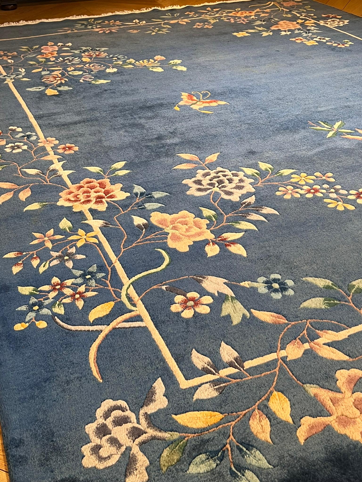 Art Deco rug light blue background with a butterfly and cascades of multicolored flowers For Sale 1