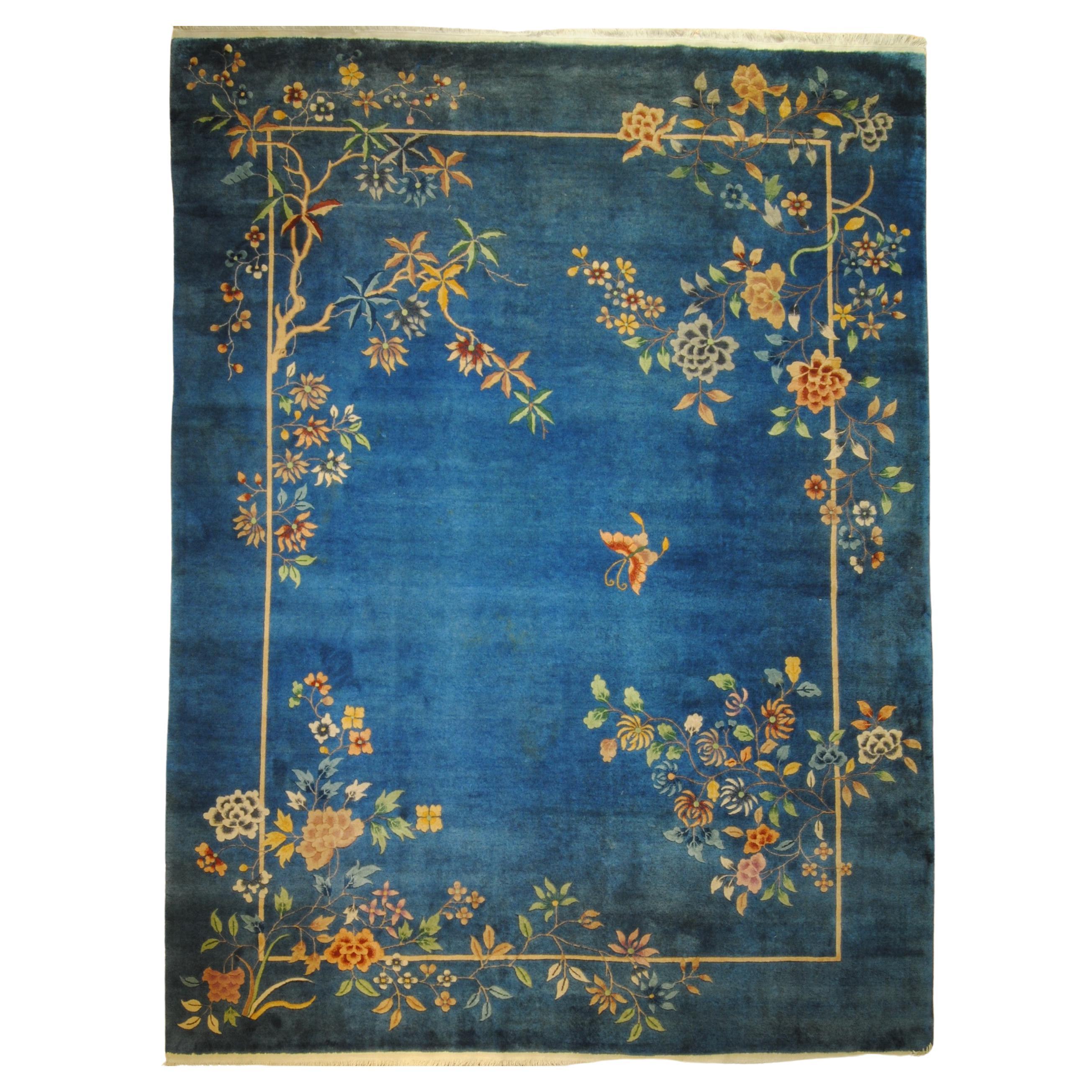 Art Deco rug light blue background with a butterfly and cascades of multicolored flowers