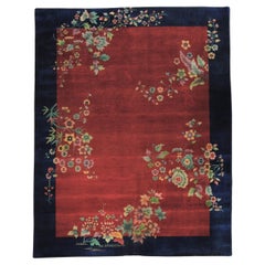 Art Deco' rug deep red background, blue border and colorful flower cascade