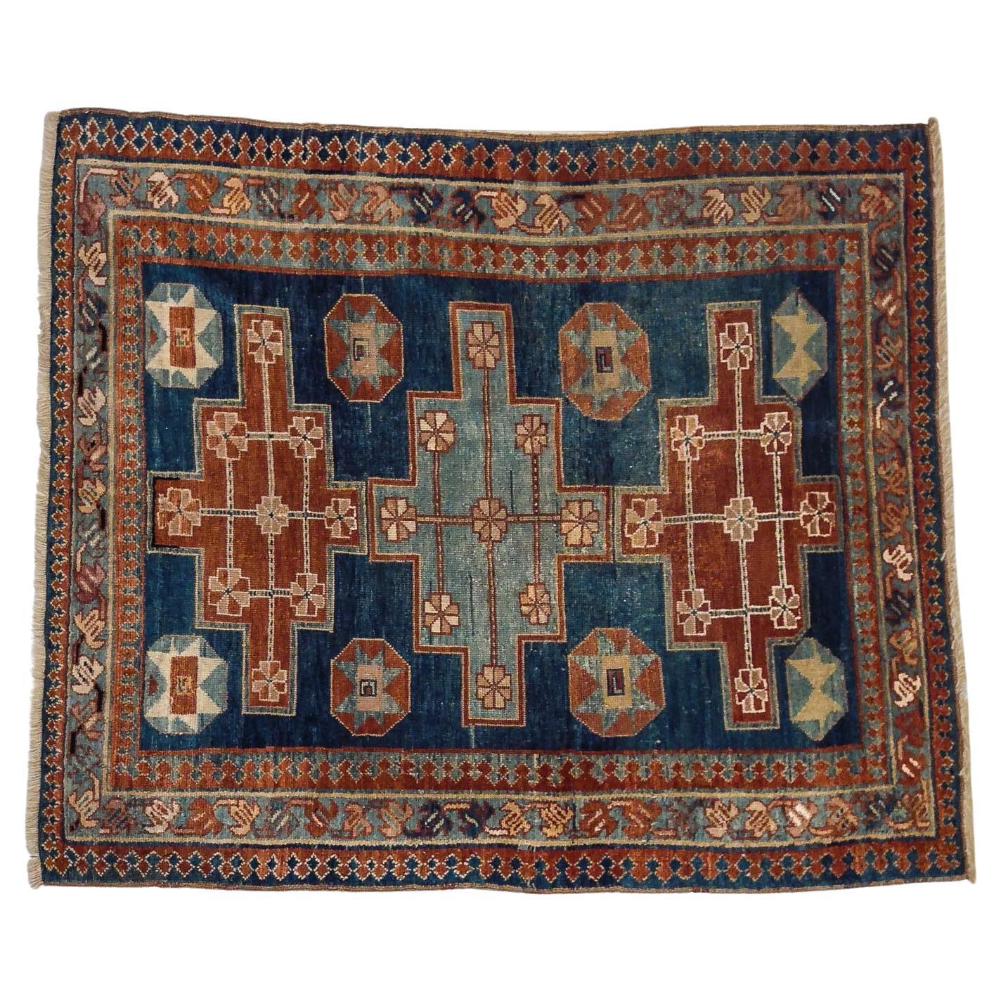 Blue hand-knotted Caucasian rug For Sale