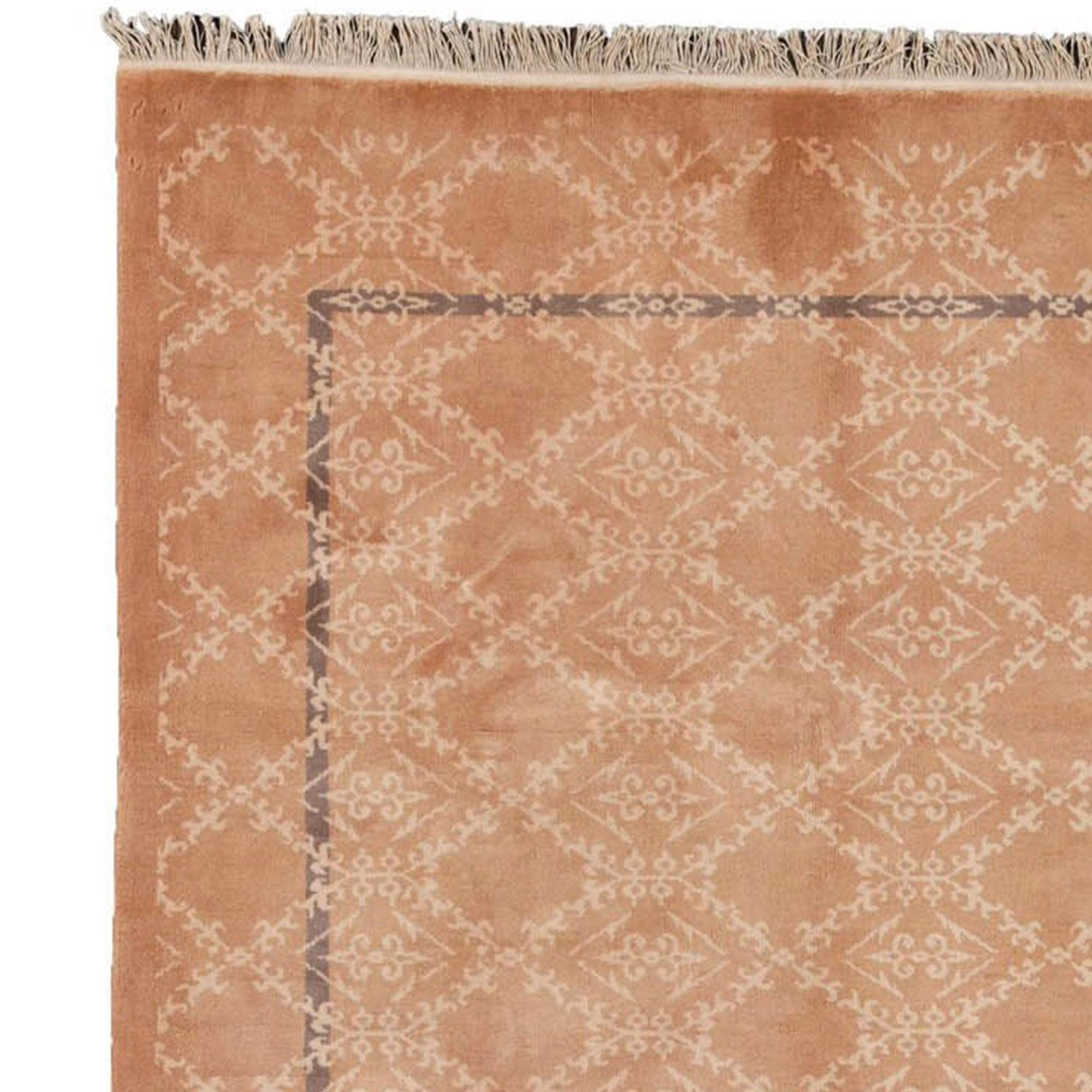 Carpet of original Imperial China. There is a repeated geometric pattern on the surface, with a darker frame that creates a depth effect. The tones are in pastel coloring, mostly powder pink with beige details and a subtle darker frame. The surface