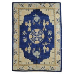 Vintage Carpet with light blue background and Chinese design from the 1930s
