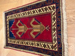 Ruby red background prayer rug of Anatolian manufacture