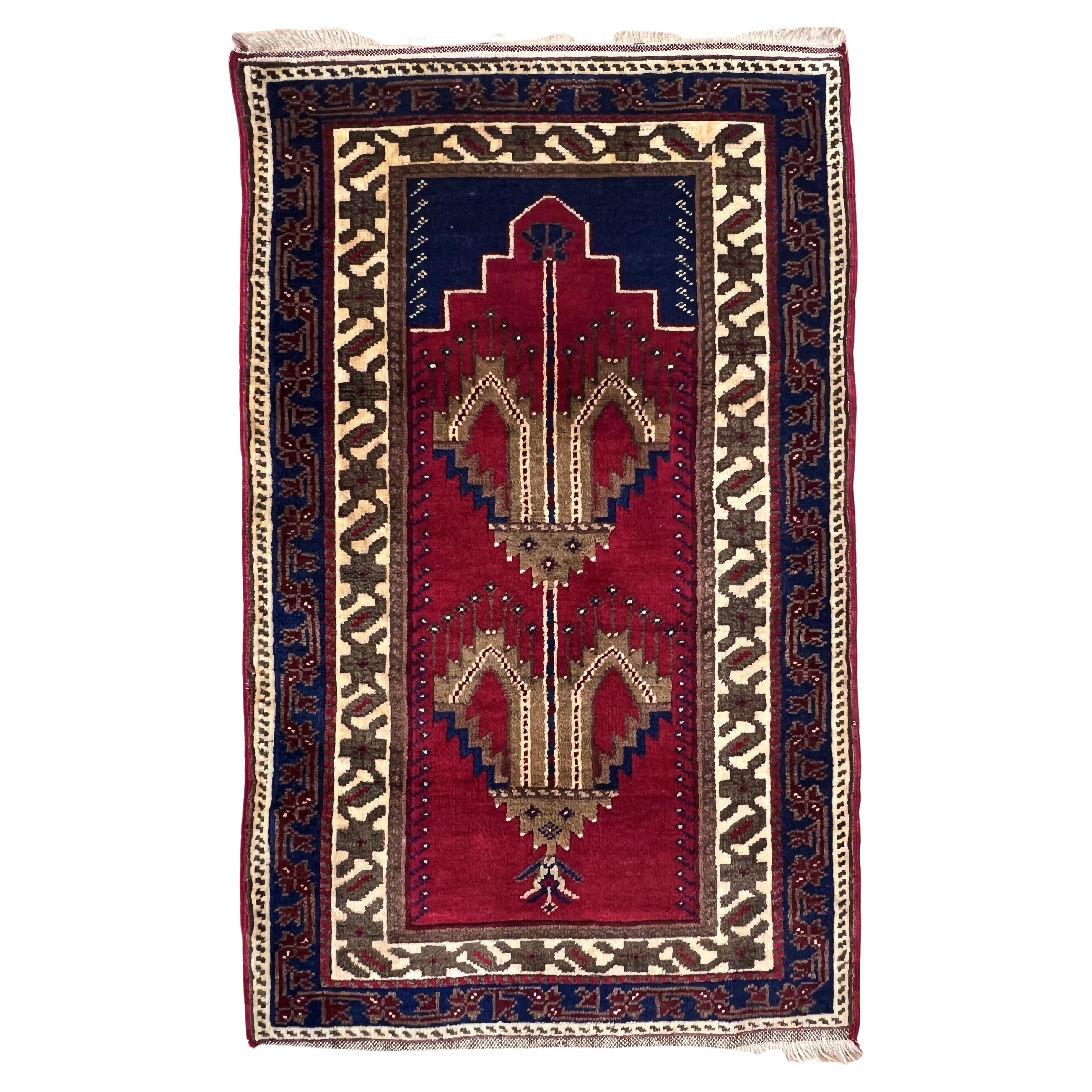 Ruby red background prayer rug of Anatolian manufacture For Sale