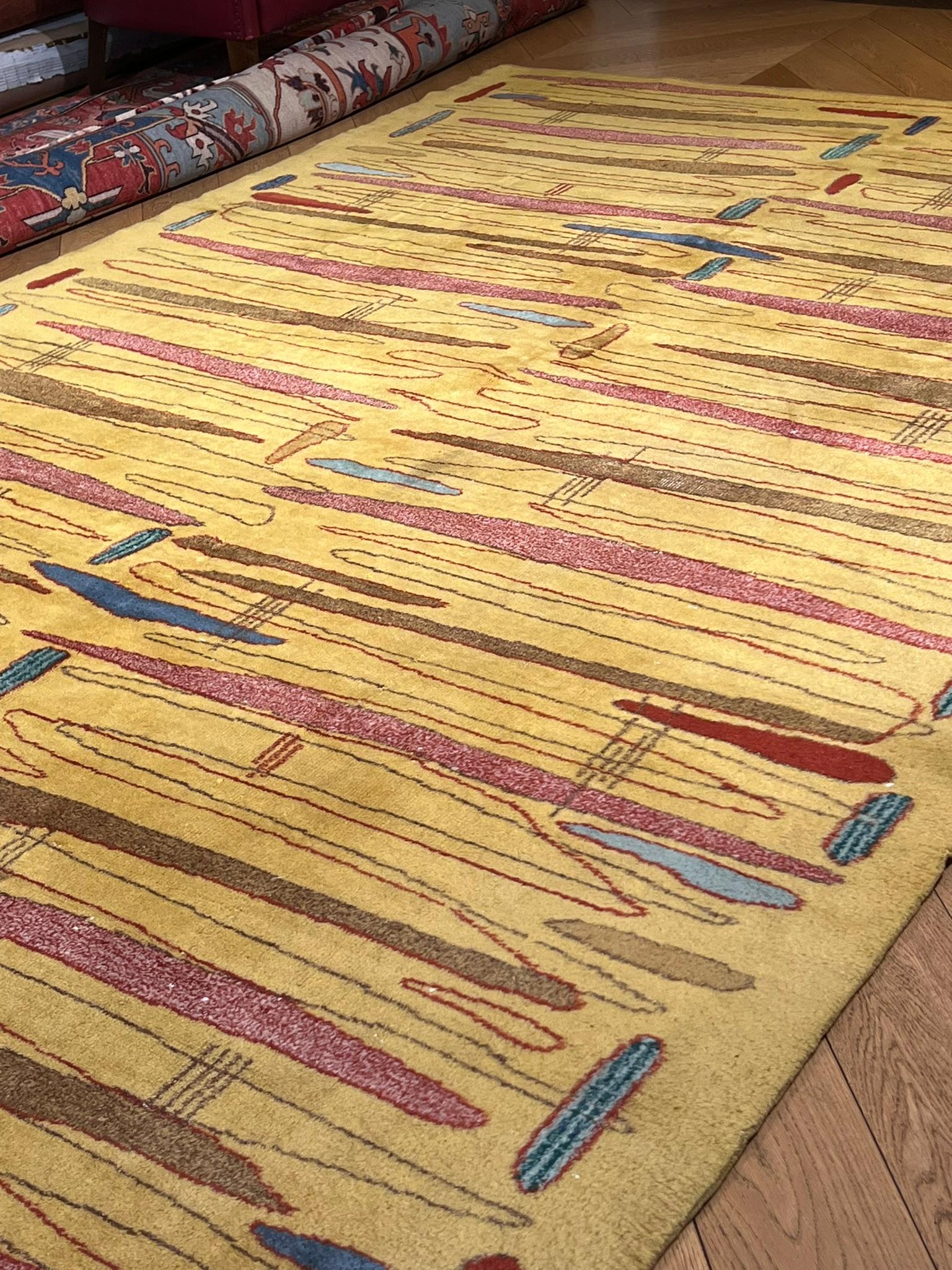 Hand-Knotted Mustard yellow rug with abstract designs of various colors designer ZEKI MUREN For Sale