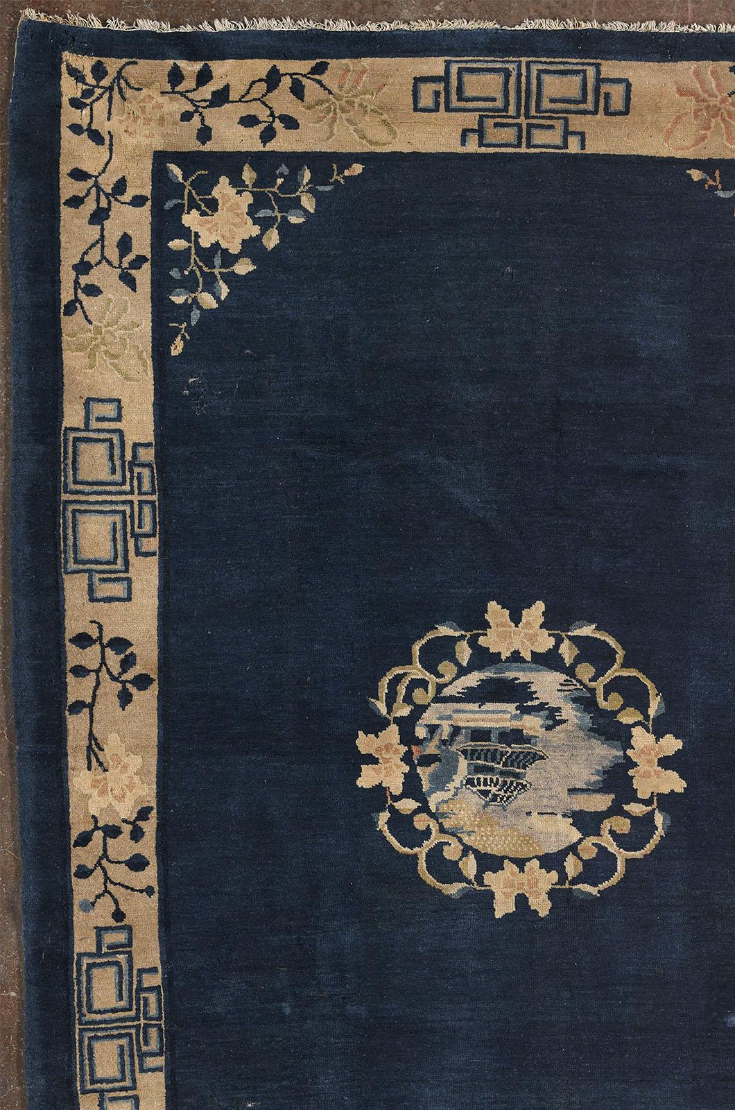 The carpet is of Chinese origin, and is characteristic of the oriental manufacturing style of the late Qing Dynasty, produced in the city of Beijing, one of the largest centers of textile manufacturing. The deep blue background is a distinctive