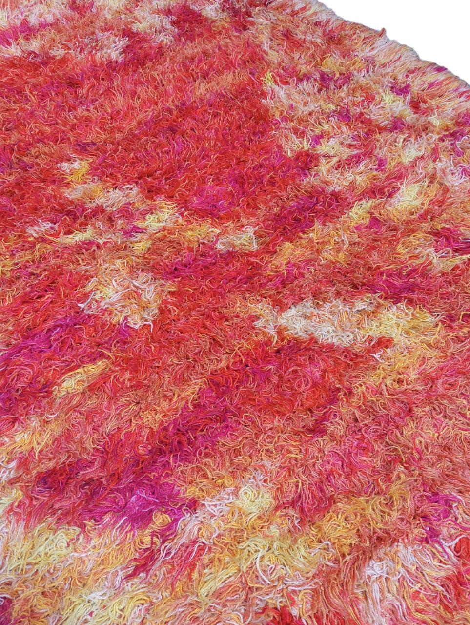 Vintage 1960s hand-knotted rug Abstract design with shades of orange yellow and pink. It is hand-knotted in Sweden, the material used is wool on cotton warp and weft. On the back it has initials on the left HA while on the right UAP.