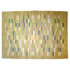Woven flatweave rug in 1970s style vibrant colors begie blue green