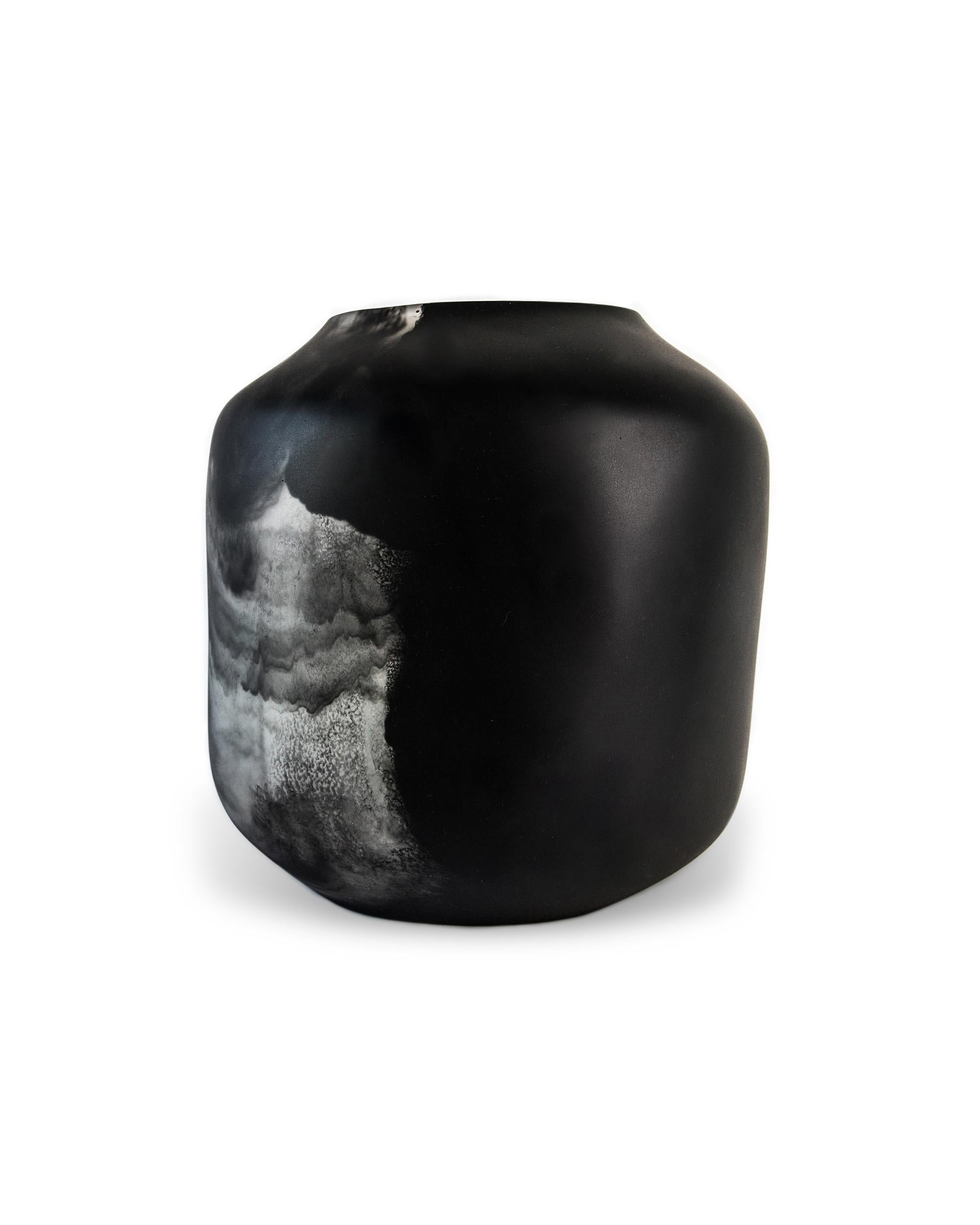 A unique resin vase for flowers, branches, or just as decor

This resin vase comes in two variations: one is all black resin, and one is made from a mix of black and clear resin that blend together in swirls and clouds reminiscent of ink dissolving