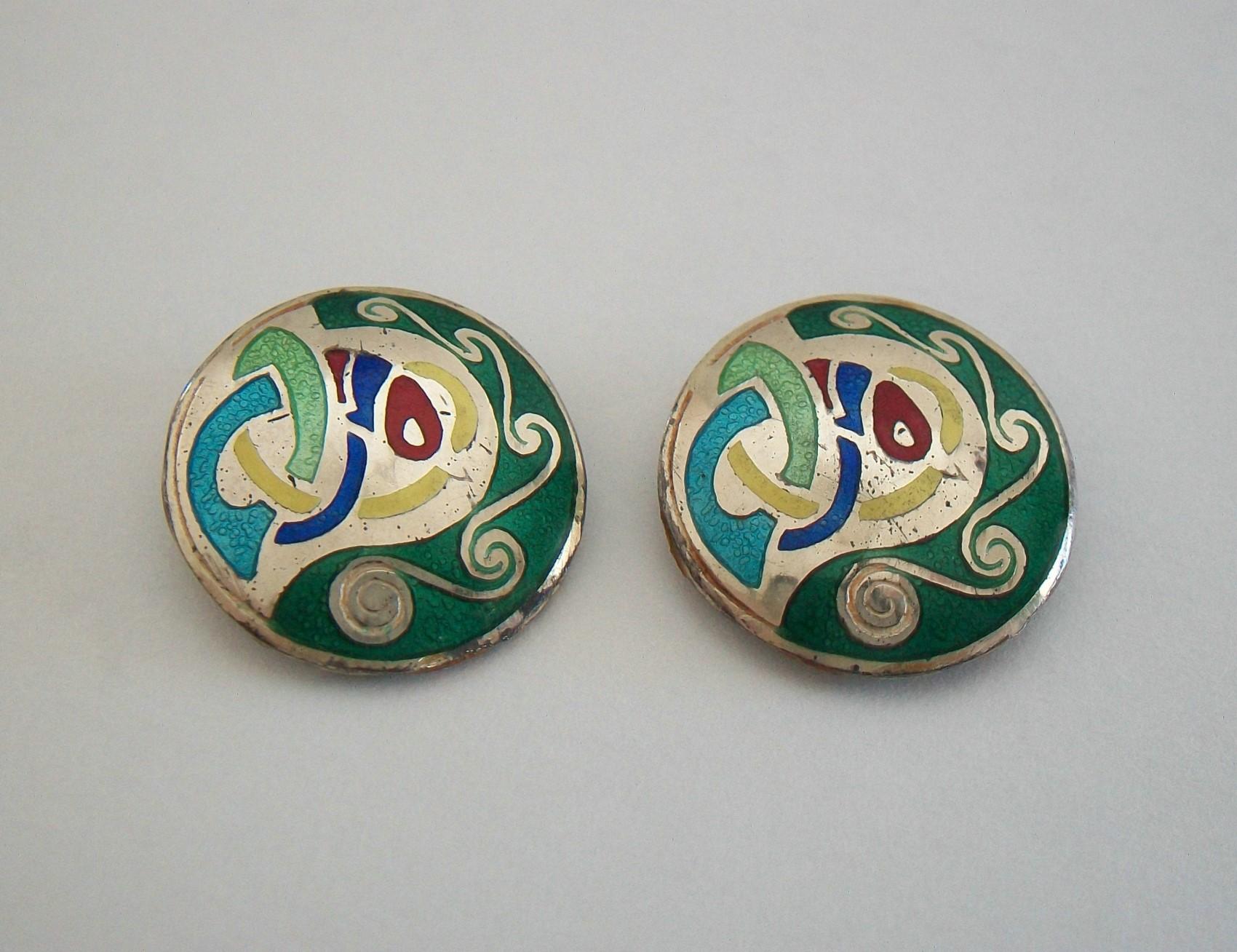 TARA WARE - Vintage pair of sterling silver and enamel earrings / ear clips - hand made - featuring Celtic designs with inset brightly colored enamels - maker's mark TW and full Irish silver hallmarks on the back of each earring (see photos) -