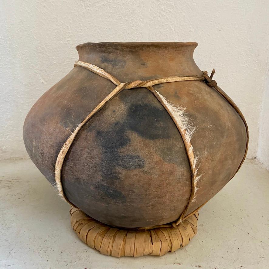 The Tarahumara (also known as Raramuri) indigenous communities are located in the Sierra Madre mountain range of Chihuahua, Mexico, The Tarahumara pottery is hand crafted by the pinch and coil method without the use of a wheel. This pot is