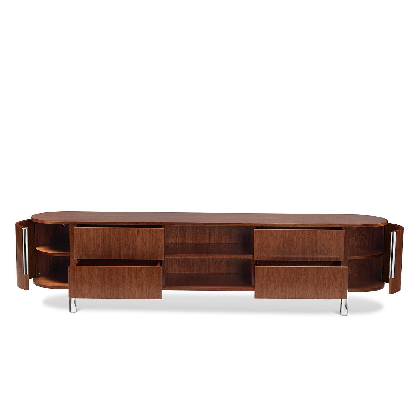A design Lorenza Bozzoli conceived to enrich sophisticated modern living rooms for many years to come, this sideboard stands out for the intensely curved sides and glistening chrome-finished metal elements that extend from the top to create sleek