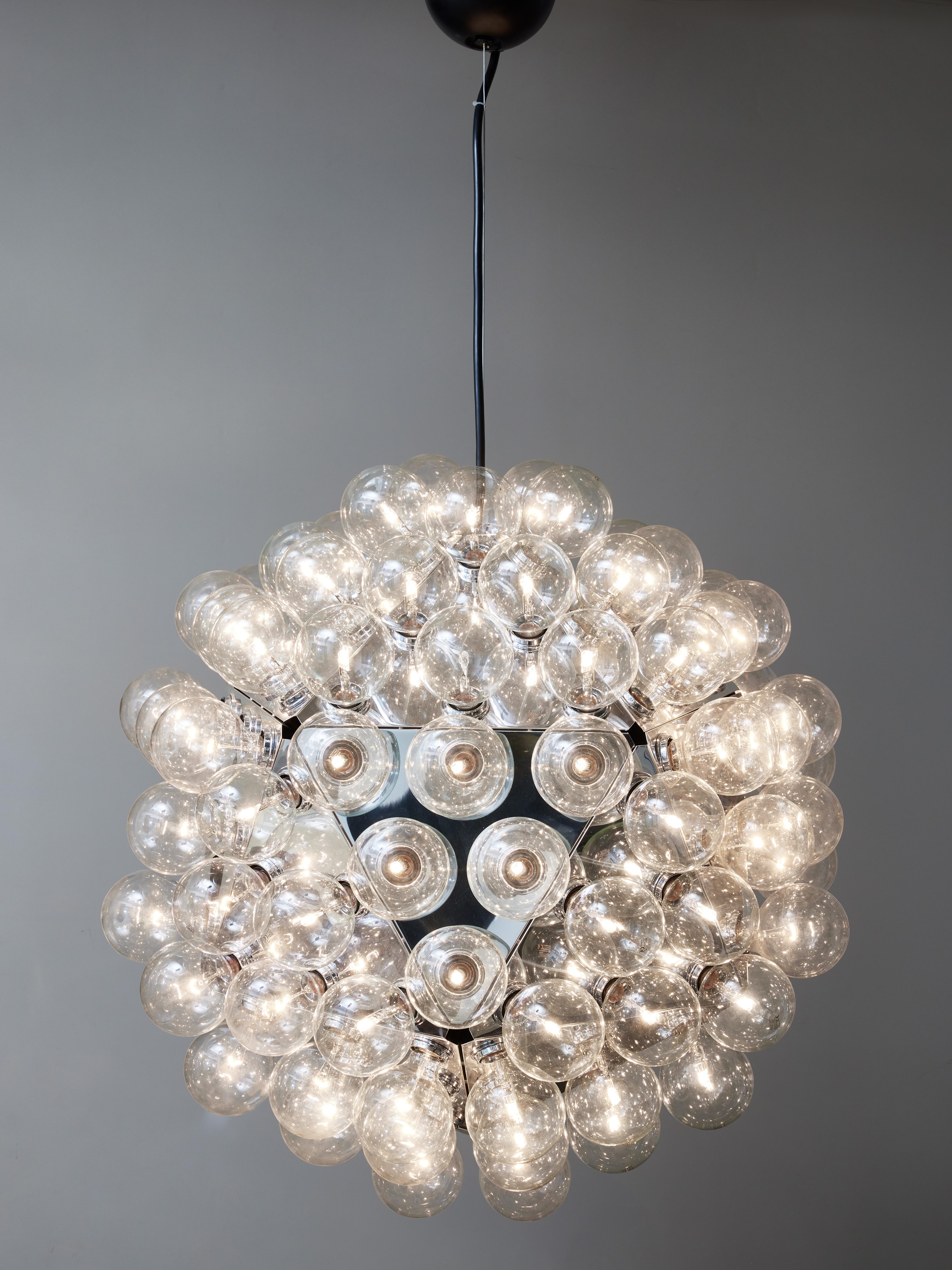 Rarer version of the Taraxacum 88, this is the 120 lights version from the early 2000s of the Classic Achille Castiglioni’s design by Flos. Made of panels of molded aluminum covered with 120 large bulbs, offering a very diffuse light hue.

Achille